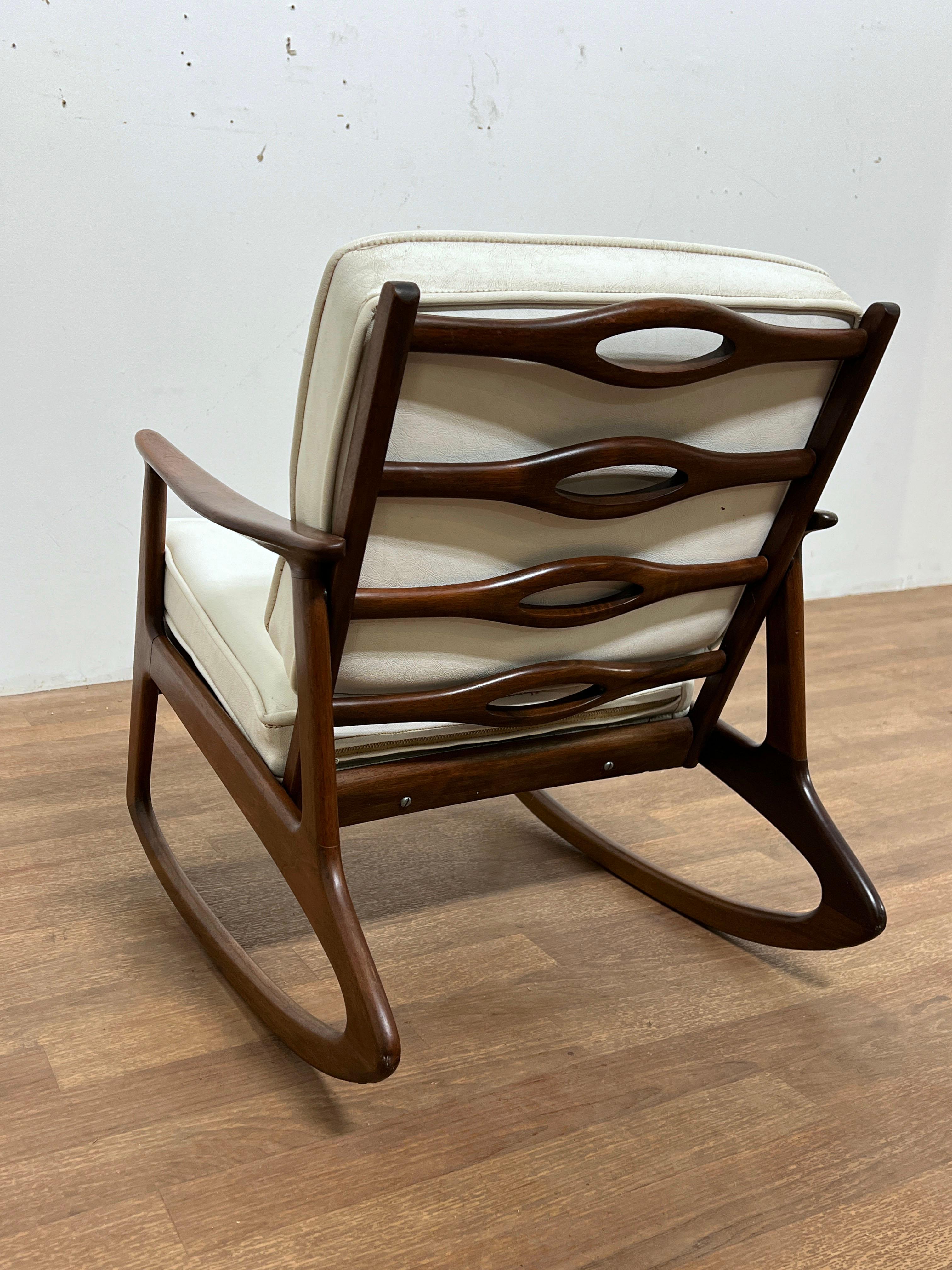 A rare child size rocker in teak, unmarked, but remarkably fine craftsmanship. Prior owners recall their parents brought this home in a box from a  trip to Copenhagen, Denmark, in the early 1960s.