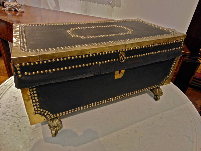 Early 19th century child's camphor wood chest

--Original black leather binding and brass tacks.