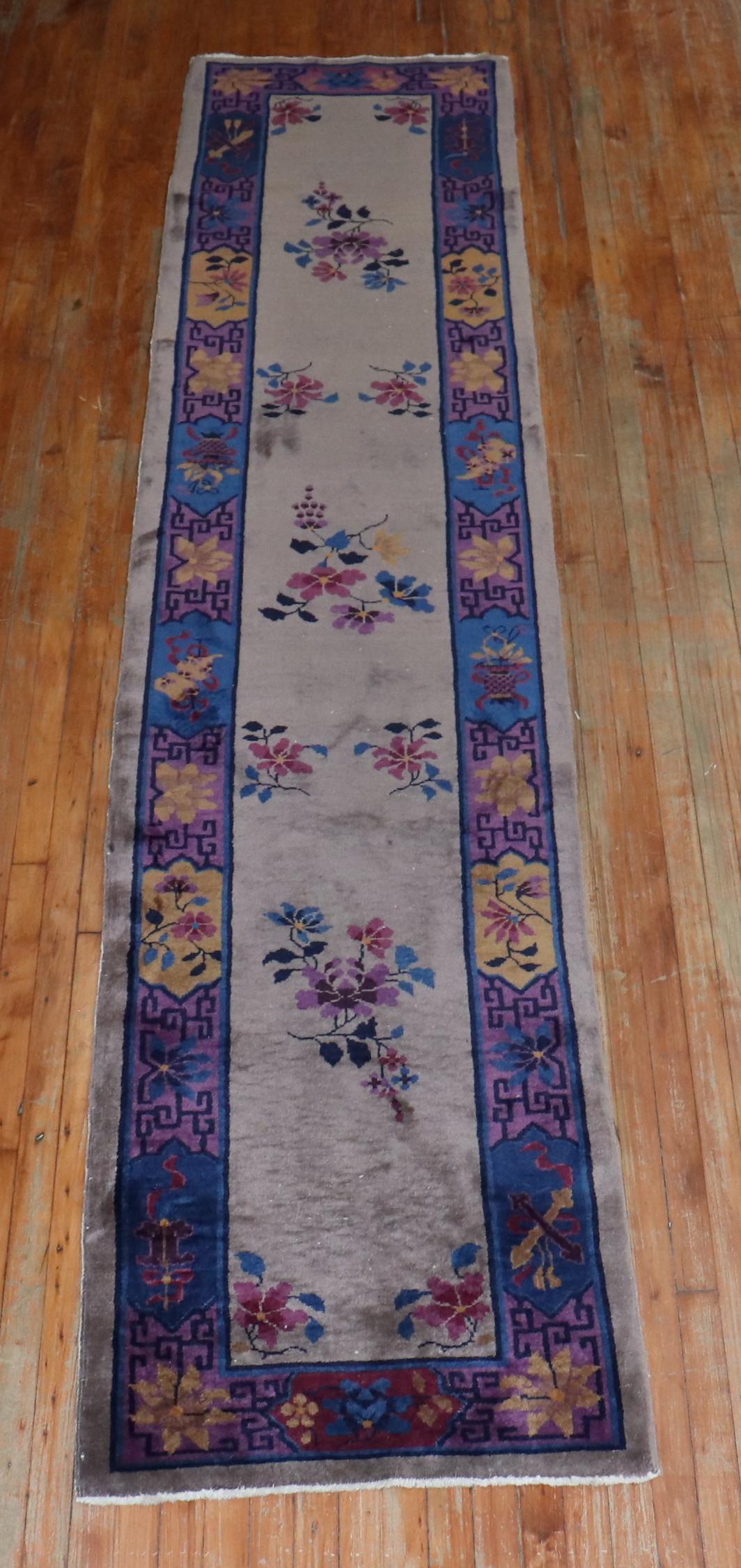 Beautiful narrow size Chinese Art Deco runner with a neutral gray colored field and navy plum border in full pile condition

Measures: 2'6