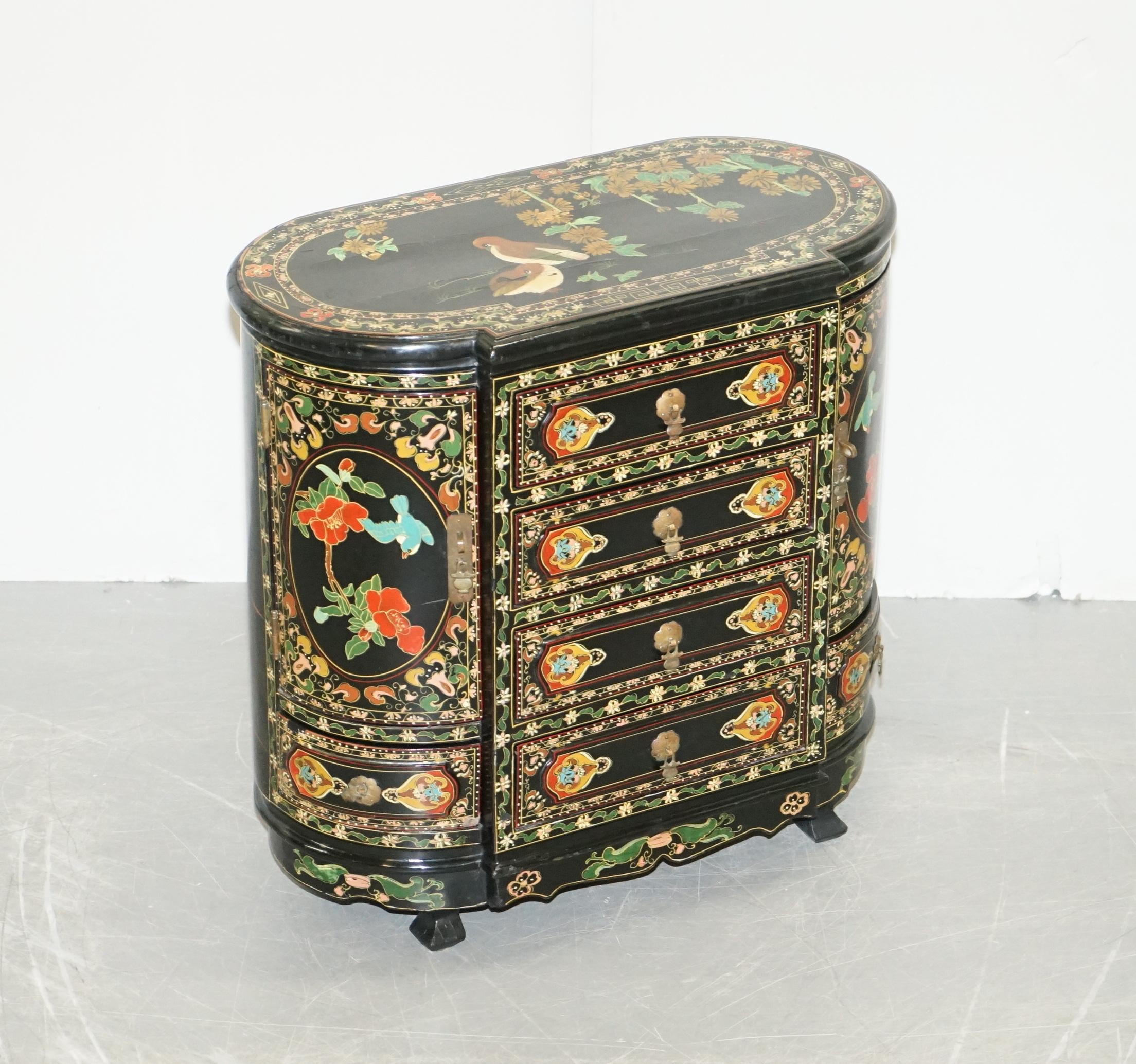 We are delighted to offer this beautiful ornately decorated Chinese Chinoiserie side table cupboard hand painted with birds and flowers

A very well made and decorative side table, it has cupboards and drawers which offer plenty of storage, the