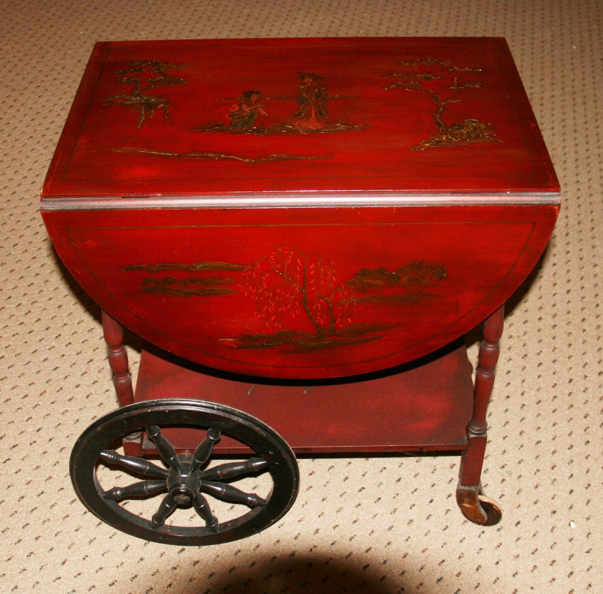 1480 Rare hand decorated tea cart with storage drawer
Drop down shelves 43