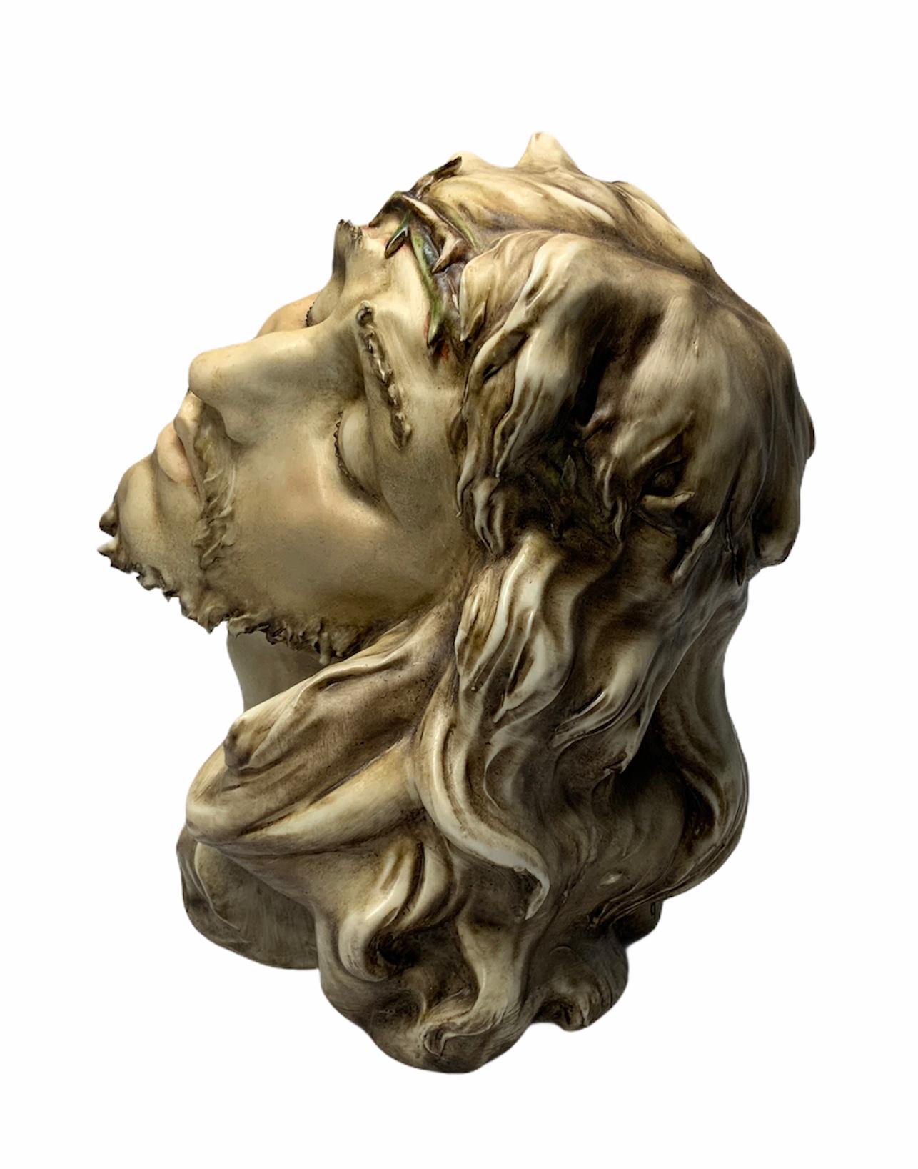 This a very well done head, face & neck Porcelain of the crucified Christ by an Italian sculptor- A.Borsato. 
The face expresses the pain & sadness of the Christ. The sculpture is marked with the stamp A.Borsato, Milano Italy and also his