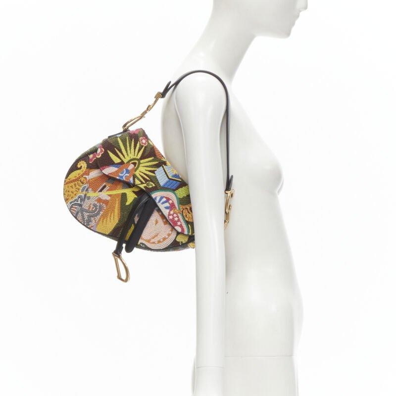 rare CHRISTIAN DIOR 2018 Saddle multi bead embellished shoulder bag
Reference: ANWU/A00002
Brand: Dior
Collection: 2018 - Runway
Material: Leather
Color: Multicolour
Pattern: Abstract
Closure: Magnet
Lining:  Suede
Extra Details: Fully embroidered