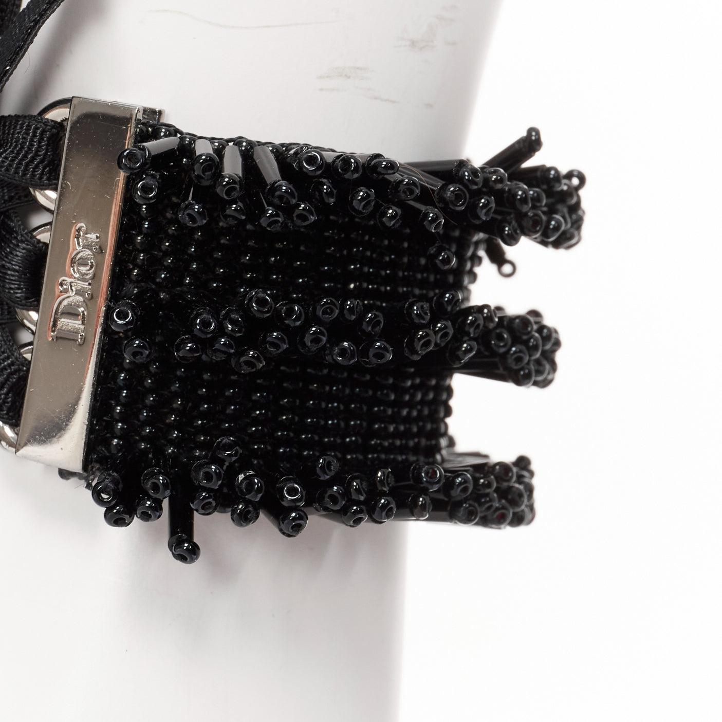 rare CHRISTIAN DIOR John Galliano Vintage black beaded corset tie bracelet
Reference: TGAS/E00003
Brand: Dior
Designer: John Galliano
Material: Fabric, Metal
Color: Black, Silver
Pattern: Solid
Closure: Self Tie
Lining: Black Fabric
Extra Details: