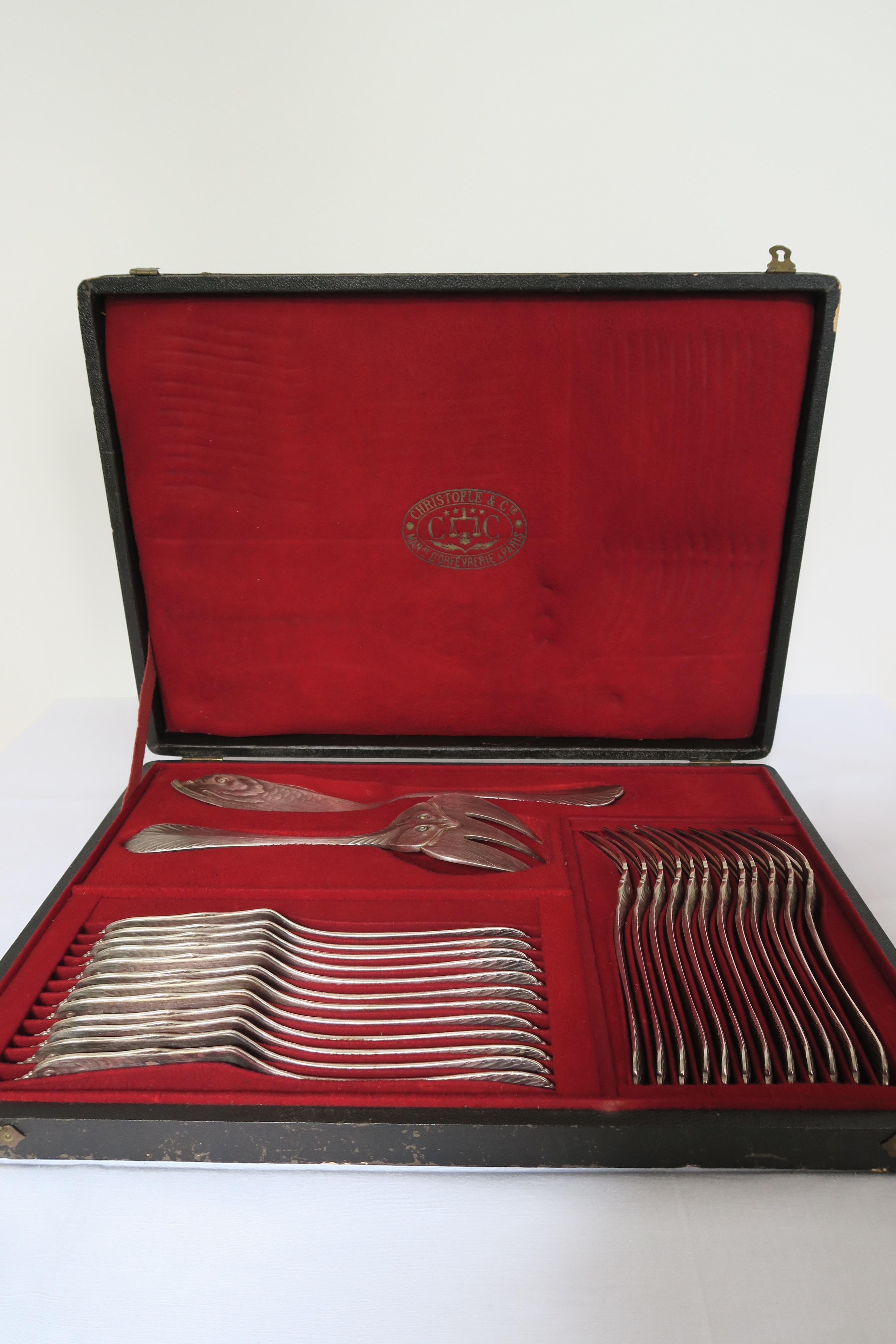 Rare and original tableware set by renowned French silverware manufacture Christofle.
The set consists of 12 fish knives and 12 forks, 1 big serving knife and 1 big fork.
They were carefully crafted from stainless steel and plated with silver to