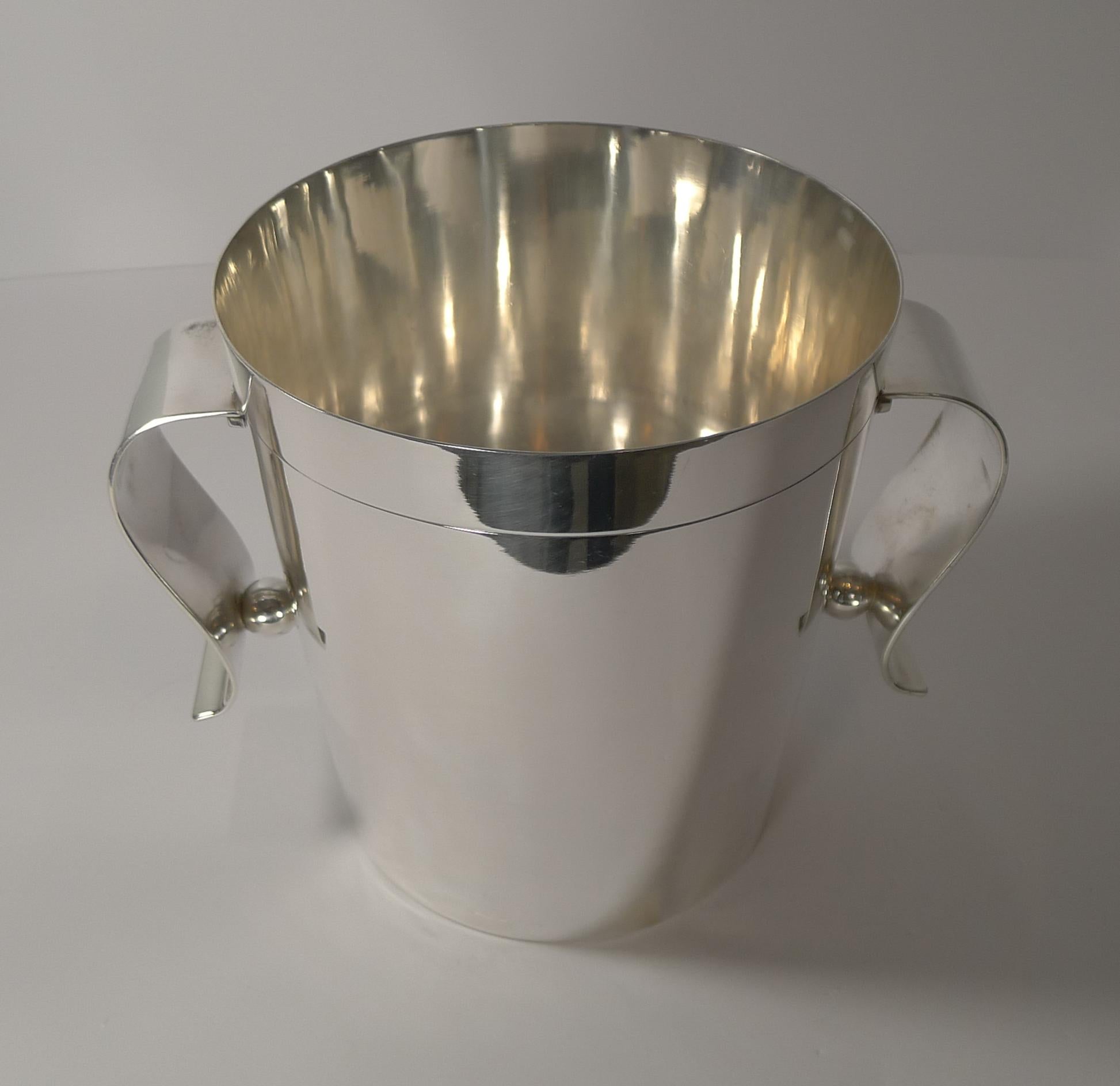 A scarce find in this design, this fabulous and stylish silver plated wine or champagne cooler is by the top-notch French silversmith, Christofle, part of the Gallia collection.

This design is by one of the most sought-after designers of the Art