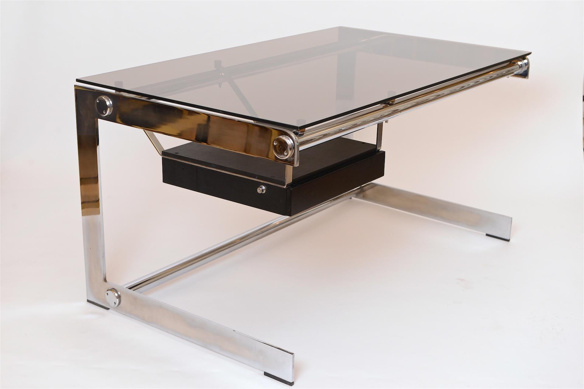 Rare chromed steel and grey glass desk, circa 1965. 

Designed by architect Gilles Bouchez and produced by Airbourne in France.
This is the smaller version 

Sleek, minimal and ahead of its time. 

Glass is original and stamped