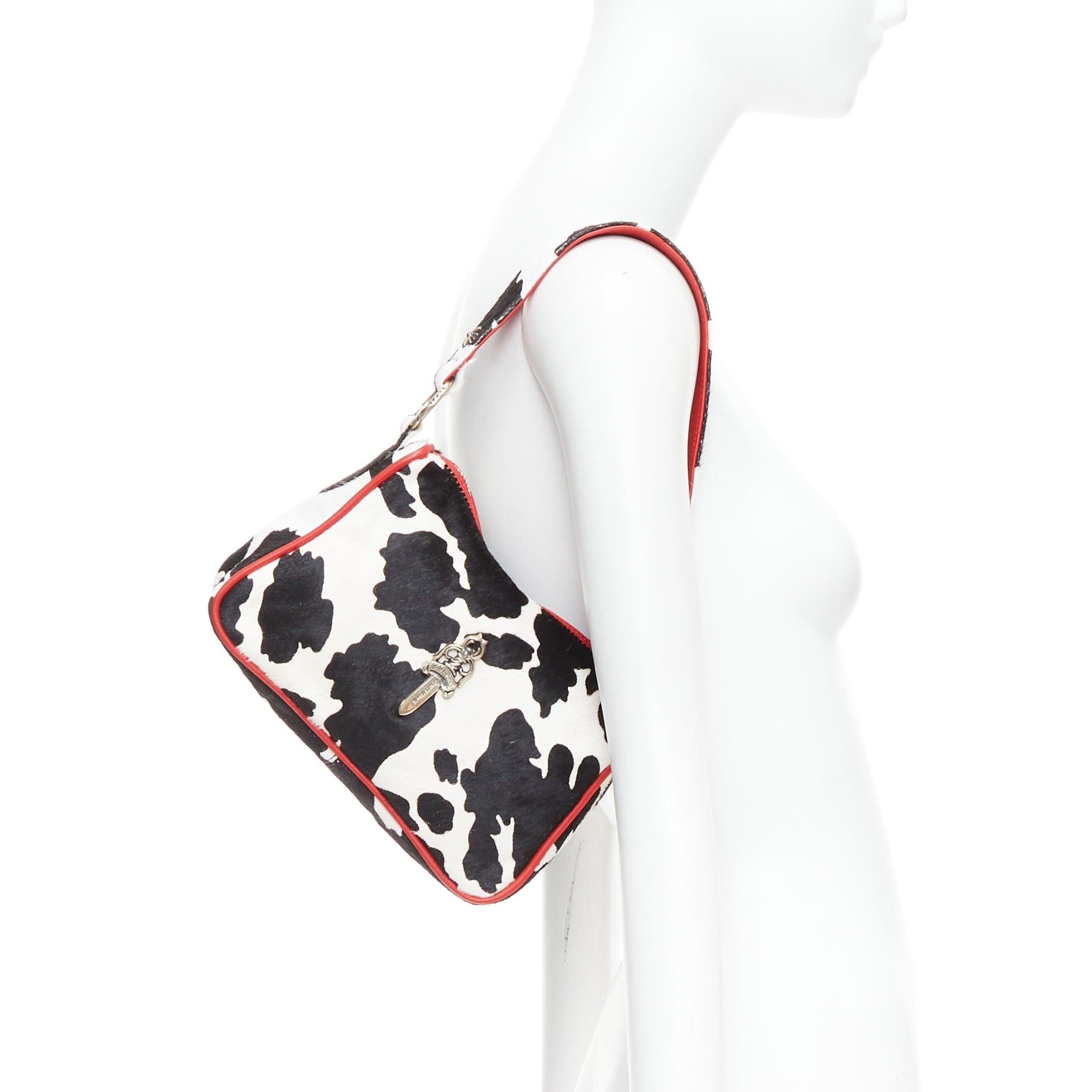 rare CHROME HEARTS Nuggets black white cow calf hair red trim underarm bag
Reference: NKLL/A00363
Brand: ChromeHearts
Model: Nuggets
Material: Calf Hair
Color: Black, White
Pattern: Cow
Closure: Zip
Lining: Black Fabric
Extra Details: 925 silver