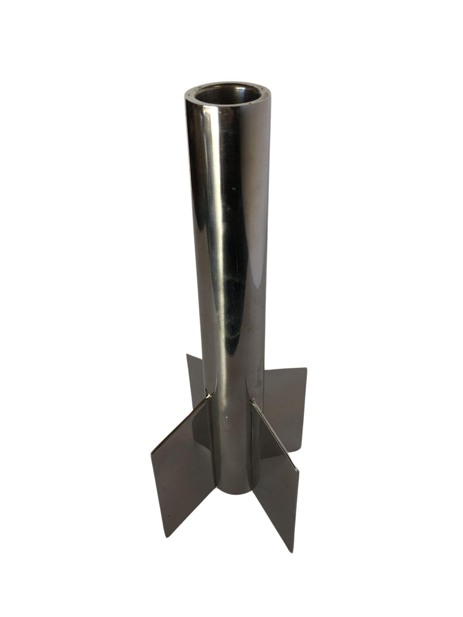 Introducing the Rare Chrome Rocketship Candlestick Holder, a captivating fusion of artistry and functionality. Crafted with precision and creativity, this unique candlestick holder is designed in the form of a sleek chrome rocketship, making it a