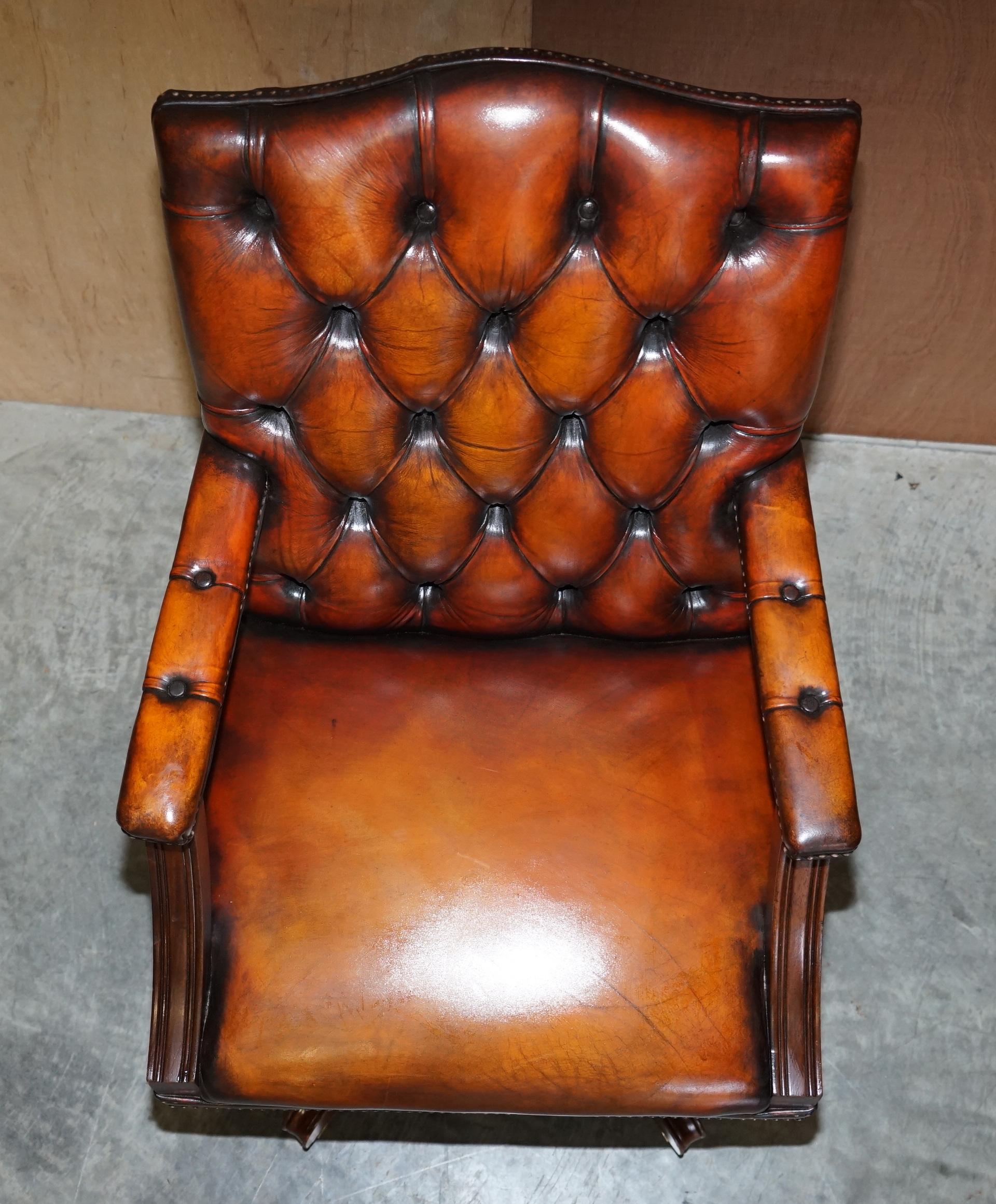 Hand-Crafted Rare Cigar Brown Leather Chesterfield Directors Captains Chair Porcelain Castors