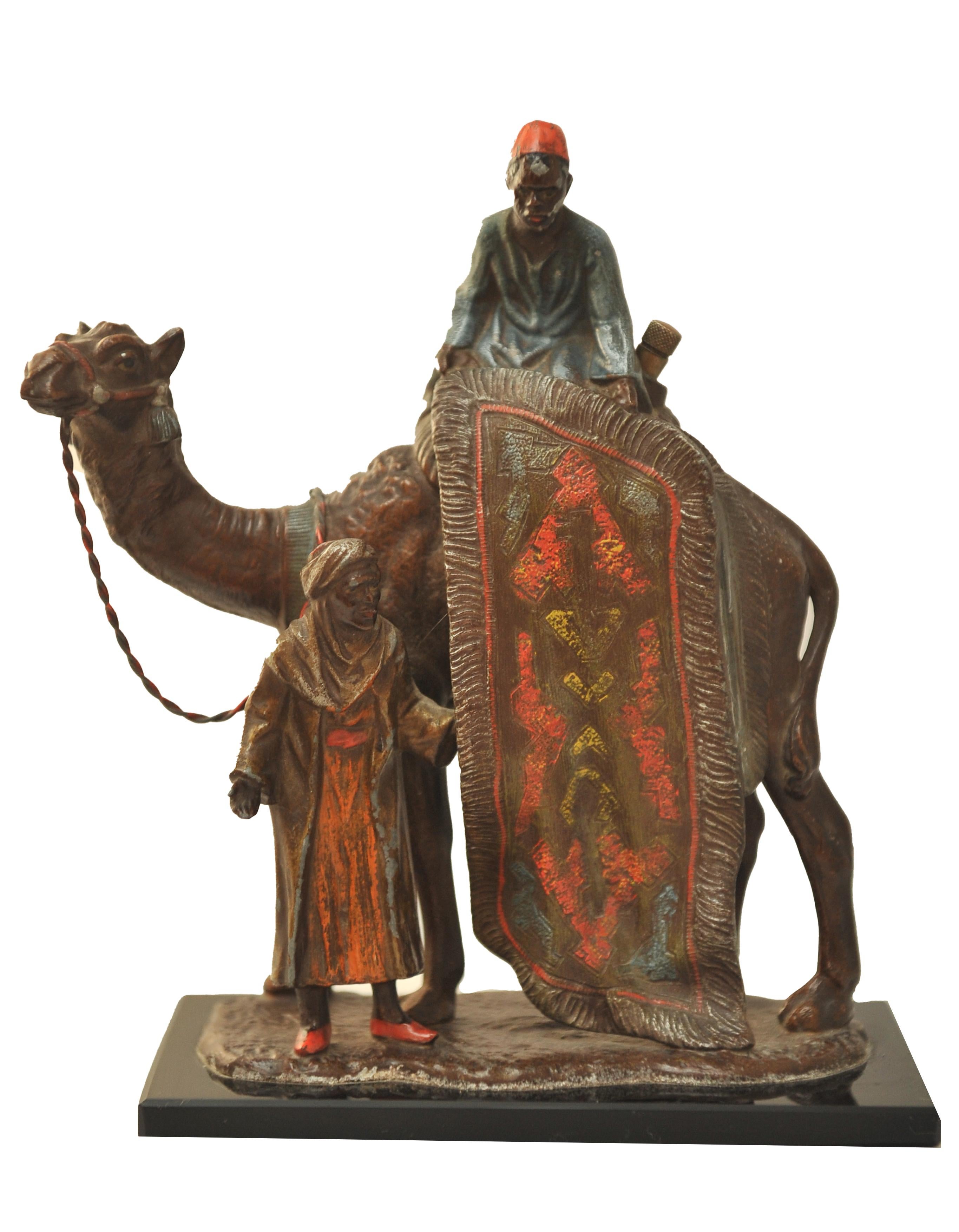 An Unusal Cigar Striker In The Franz Xaver Bergman Style Art Deco Cold Painted Vienna Bronze, Arabian Carpet Trader With Camel Mounted on a Black Glazed Base 

Made in Austria

Very heavyweight well executed piece.
