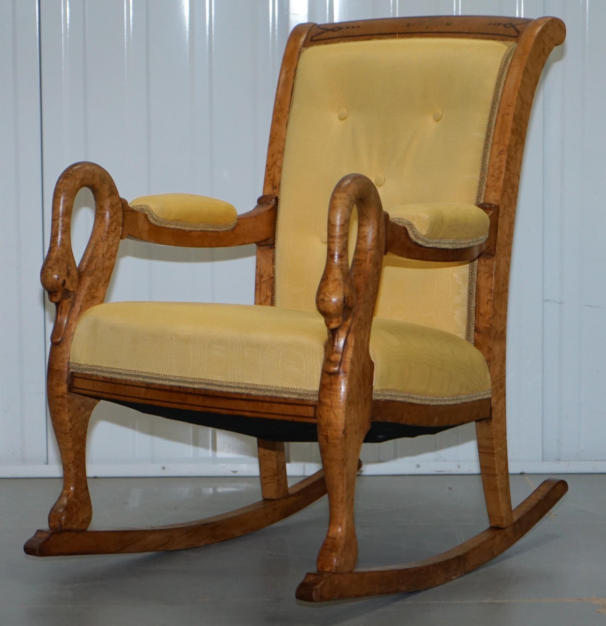 antique rocking chair with swan head arms