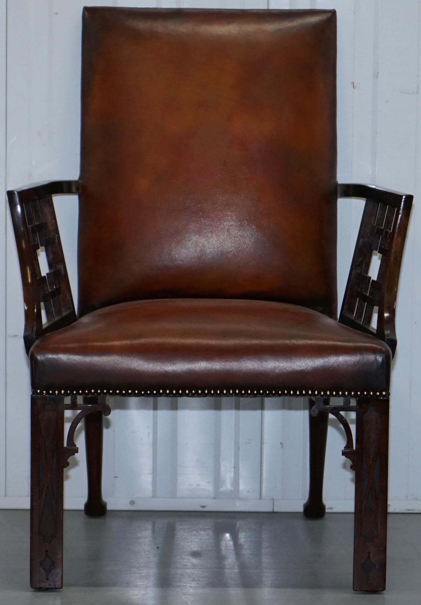 We are delighted to offer for sale this lovely circa 1830 in the manner of Chinese Chippendale fully restored brown leather hand dyed armchair

A fantastic looking and well made piece, the chair has been fully restored to include being stripped