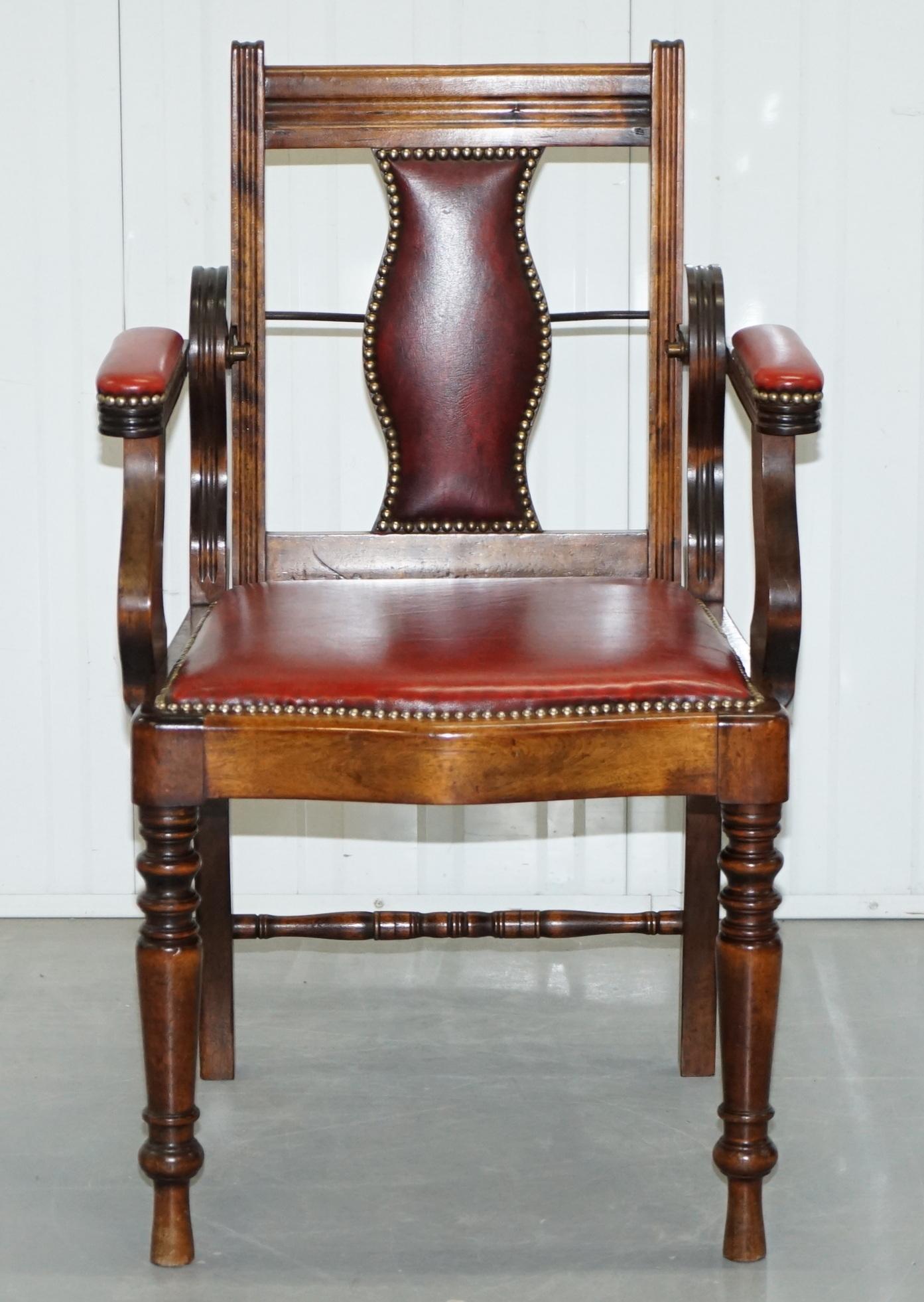We are delighted to offer for sale this rare circa 850 English oak barbers chair with oxblood leather upholstery

A good looking and rare find, the back reclines using the original engraved and patented mechanism. The upholstery is in fine order