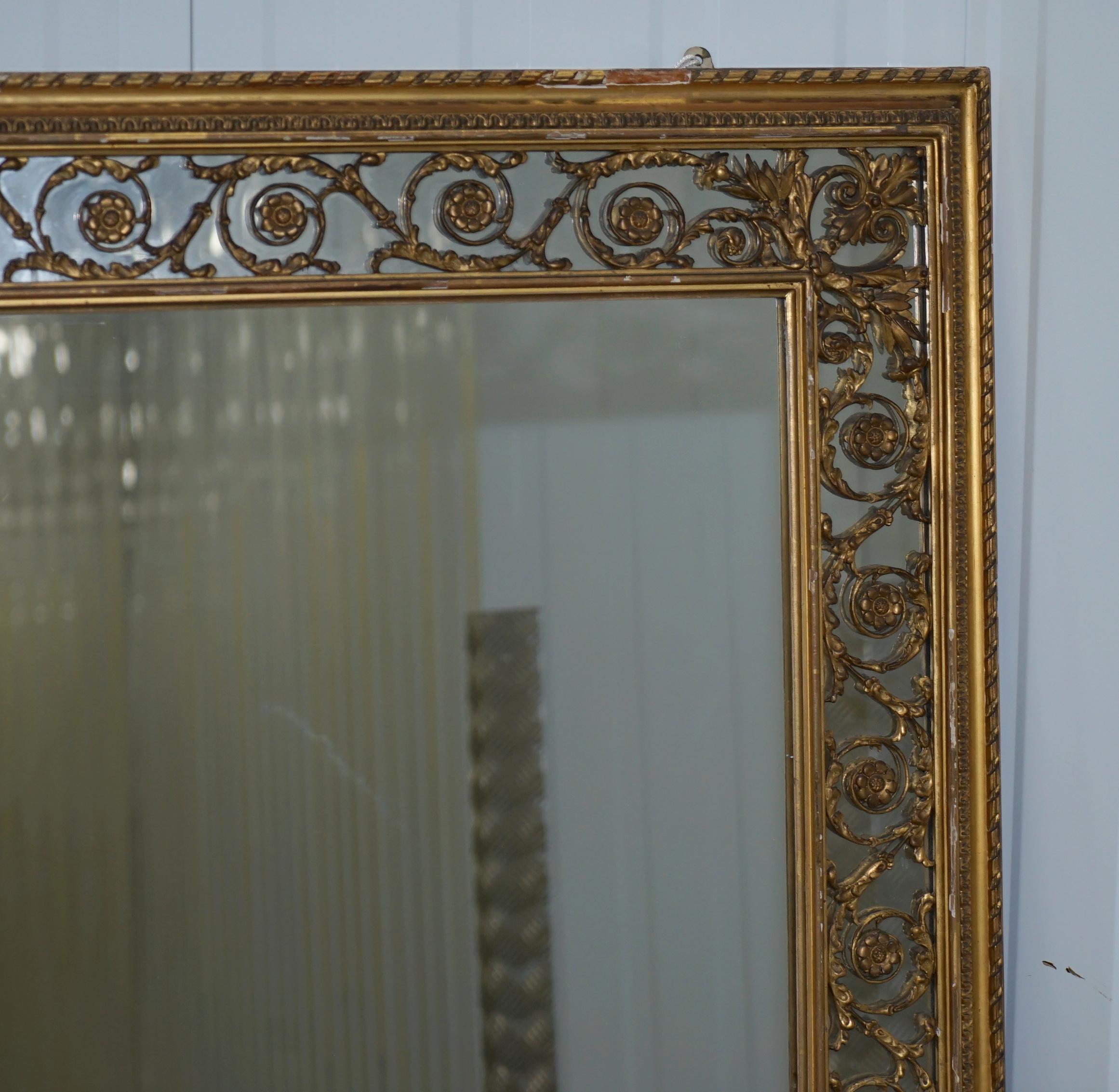 We are delighted to offer for sale this lovely early Victorian circa 1860 Charles Nosotti over mantle mirror with original mercury plate glass

A large and substantial Victorian gilt framed over mantel mirror made by Charles Nosotti, circa 1860,