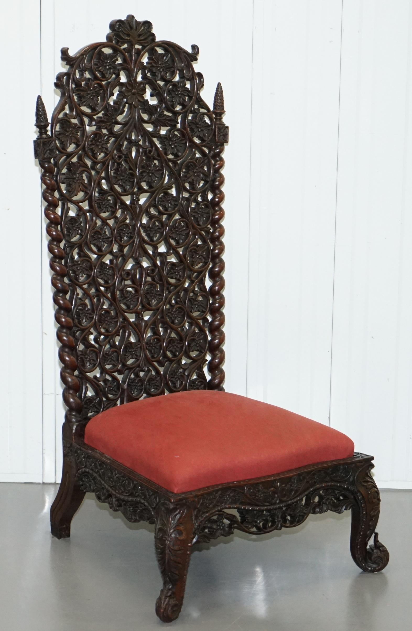 We are delighted to this absolutely stunning solid Rosewood hand carved high back low seat Burmese chair

A truly stunning piece, this type of furniture is just about as ornate as you will see anywhere in the world, intricately hand carved from