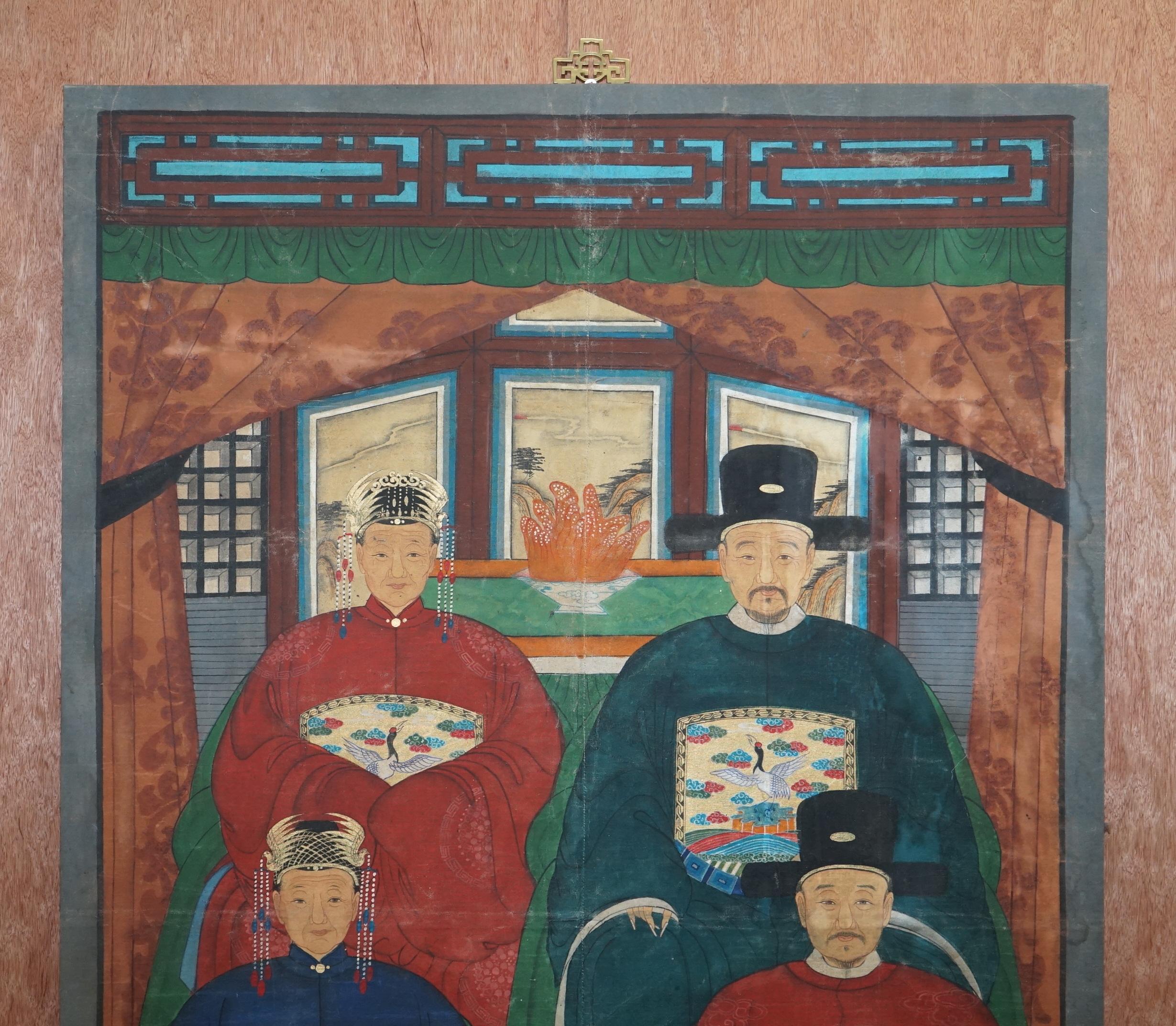 We are delighted to offer for sale this very rare Chinese ancestral oil on canvas family painting which is part of a suite

The is the large one, it depicts four very important looking family members in some kind of ceremonial dress robes. The