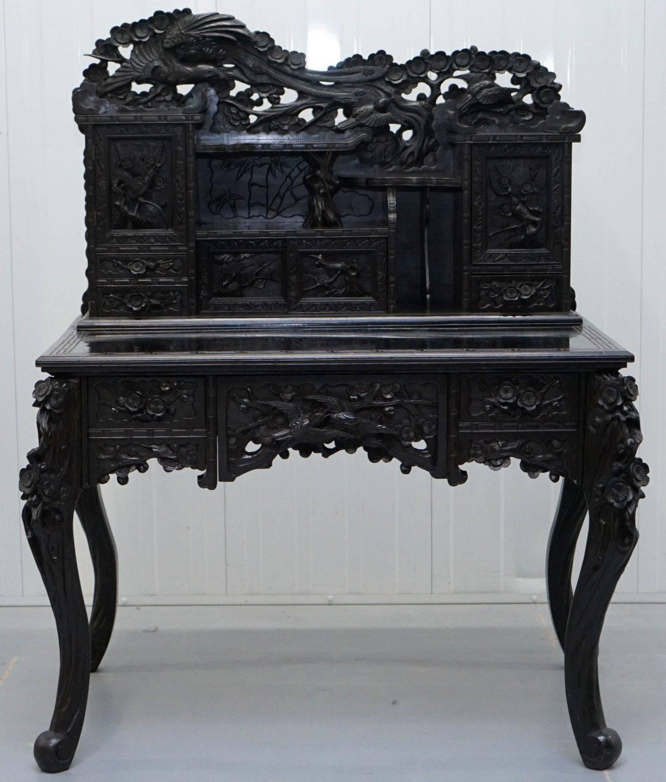 We are delighted to offer for sale this jawing dropping circa 1900 hand-carved Chinese export hand-carved solid teak writing desk with Ebonised black lacquered finish 

A very good looking and well-made piece, I’ve not seen another of this quality