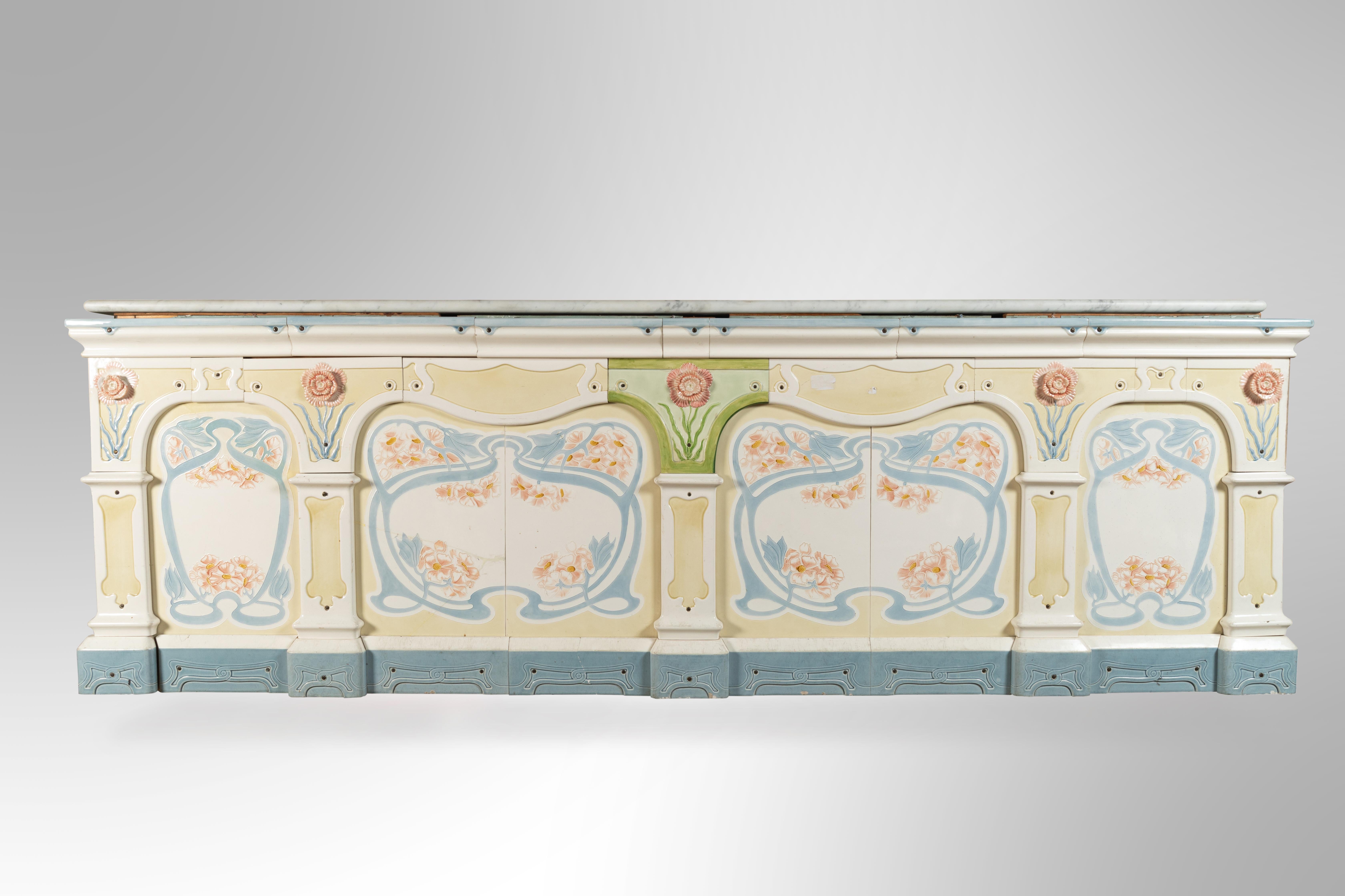 Rare dairy store creamery counter in colored earthenware, Circa 1900 period. White and grey marble top. This case piece bears the label - Heinrich Nax, Frankfurt. Minor restorations needed.