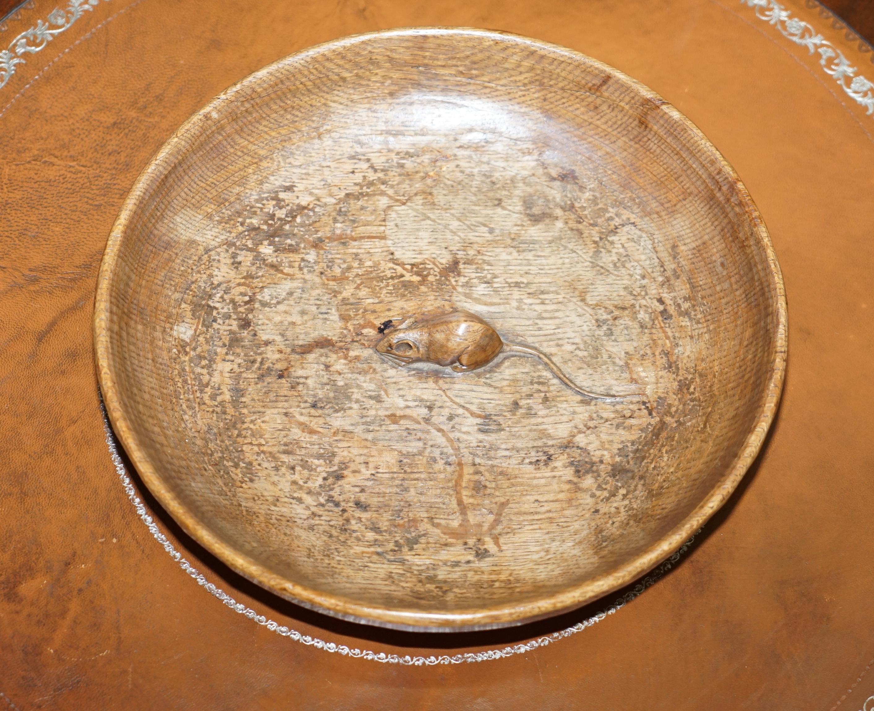 We are delighted to offer for sale this stunning original circa 1960s large Robert Thompson Mouseman fruit bowl

A stunning find, this piece has the mouse with the long tail and whiskers which means its an early example. It has the darker highly