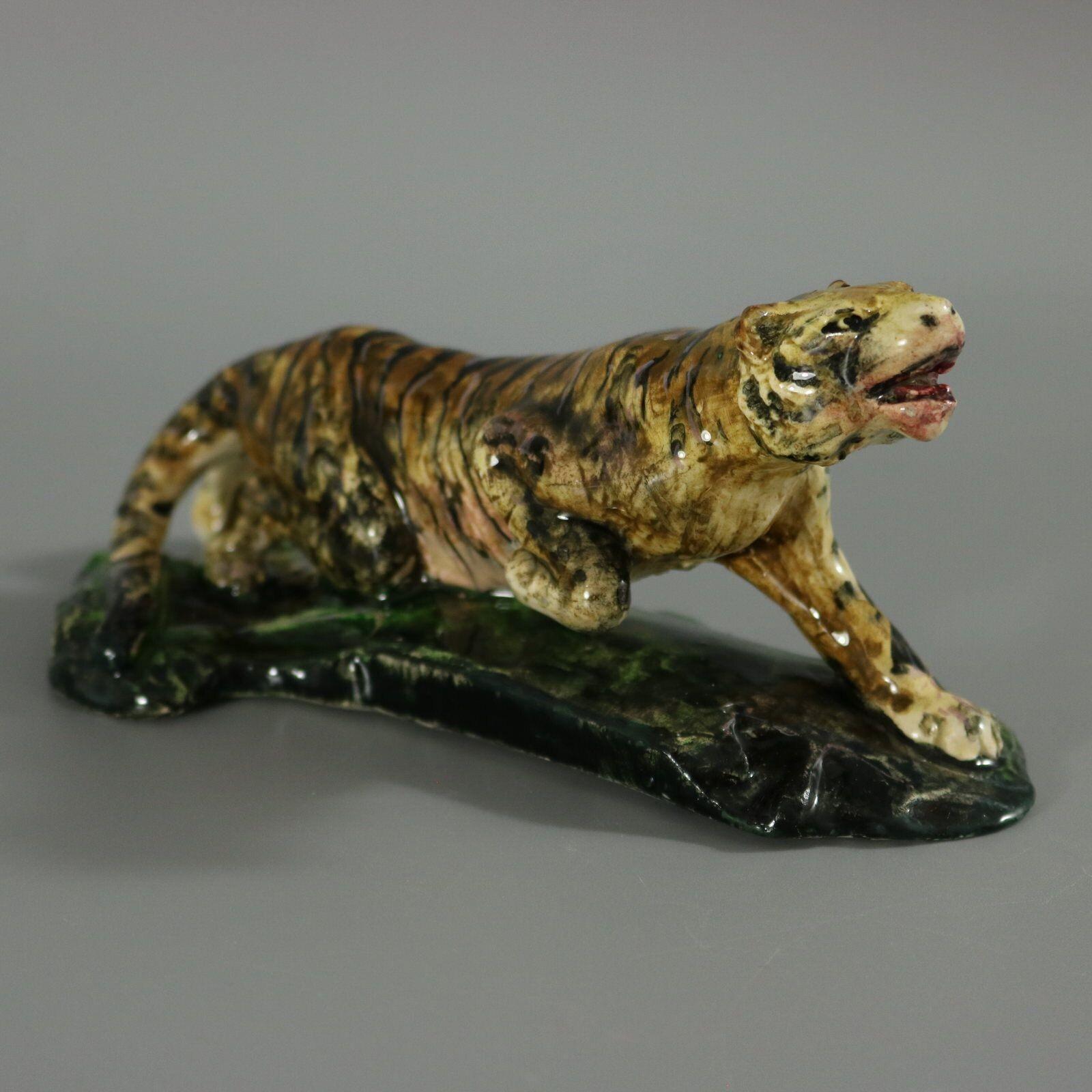 Clement Massier French Majolica figure which features a prowling tiger. Colouration: orange, brown, green, are predominant. The piece bears maker's marks for the Clement Massier pottery.