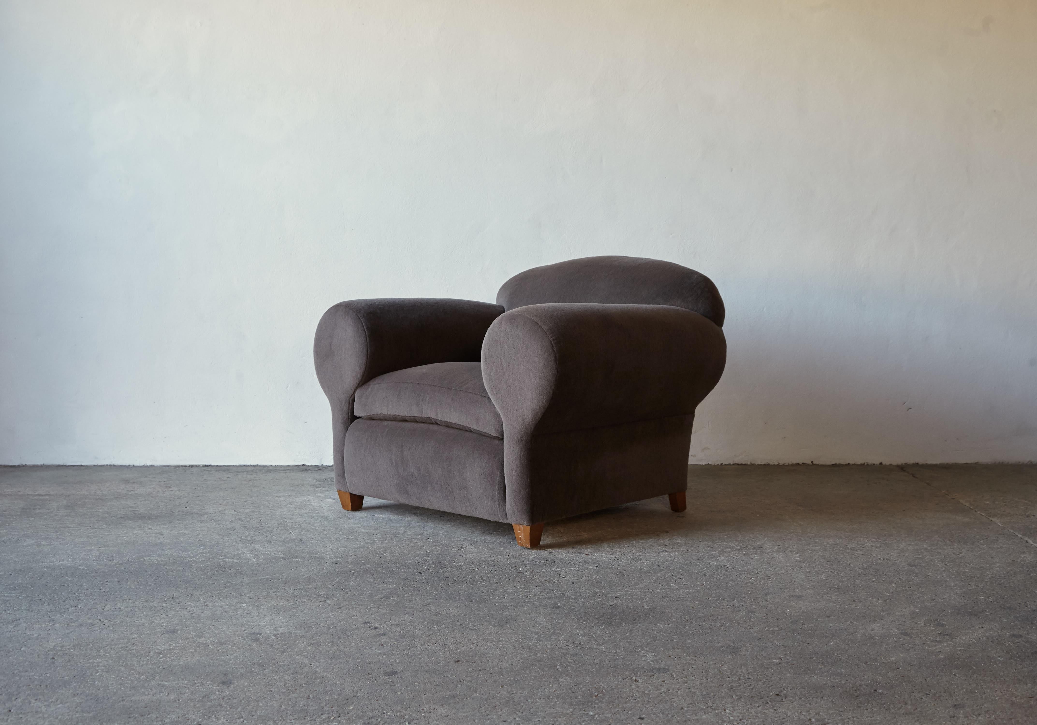 A superb rare 1940s / 1950s oversized club chair reminiscent of Maison Gouffe / Jean Royere. Newly upholstered in a premium, soft, dark grey (with a hint of brown) pure alpaca fabric. Fast shipping worldwide.
  
