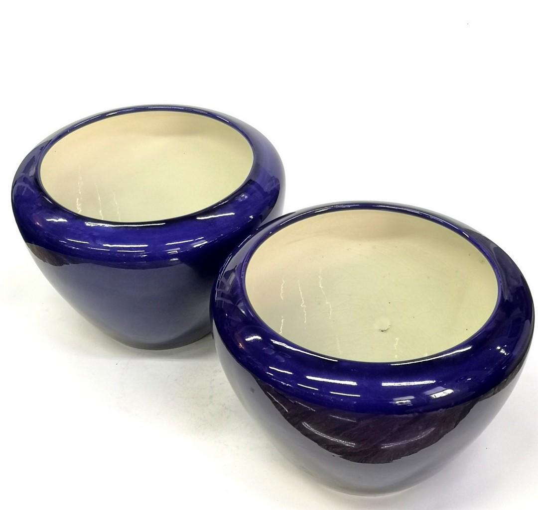 This cobalt blue pair of planters were made for the 1911 Torino World Exhibition- by Zsolnay. There's no damage, no chipping on either one. Round Zsolnay mark on the base (from the 1900s period) and a design number 8481.
