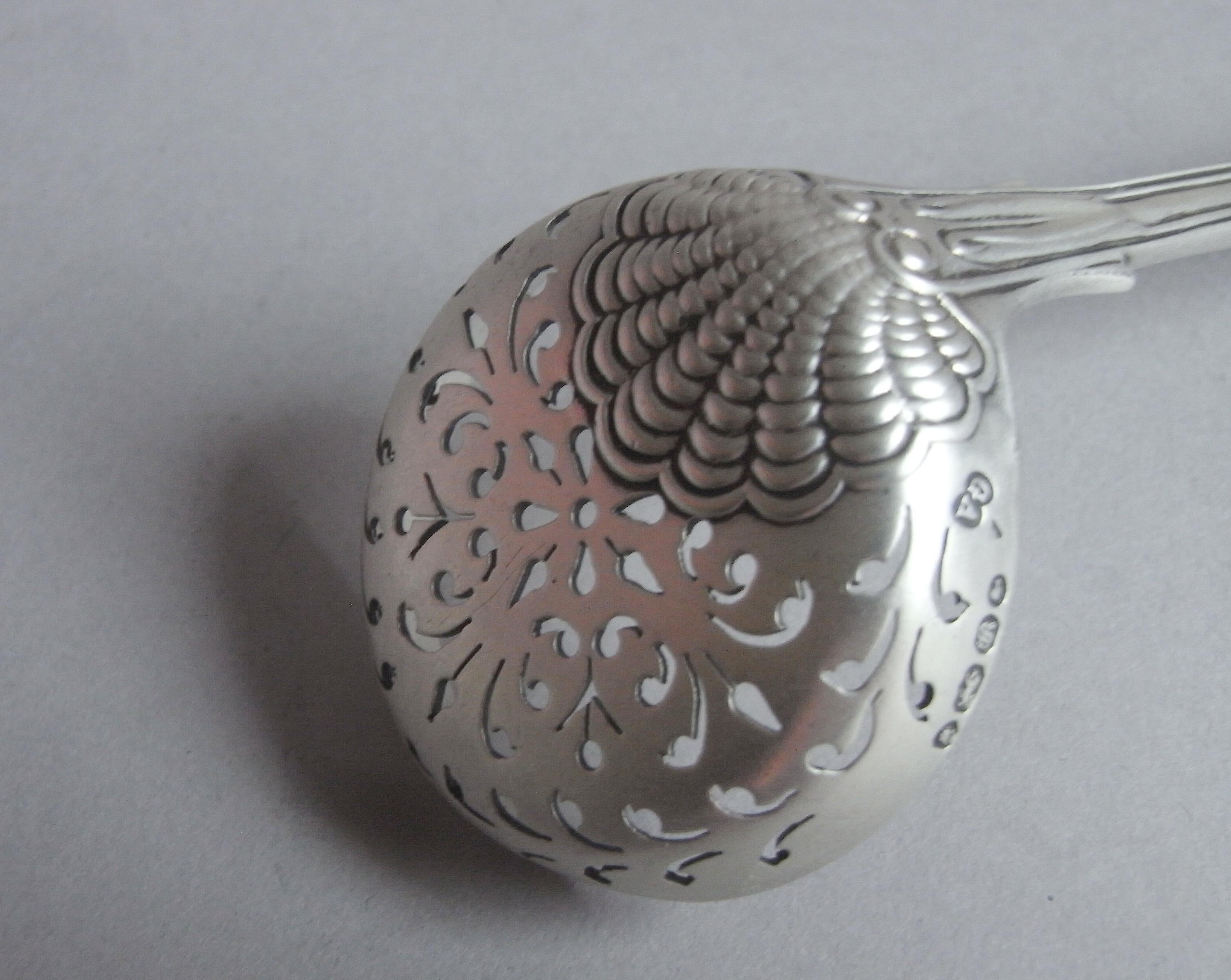 A Rare Coburg Pattern Sifter Spoon Made in London in 1853 by George Adams

The Sifter is modelled in the rare Coburg Pattern, with crisp detailing, including the raying shell on the reverse of the bowl.  The circular bowl is pierced with scroll work
