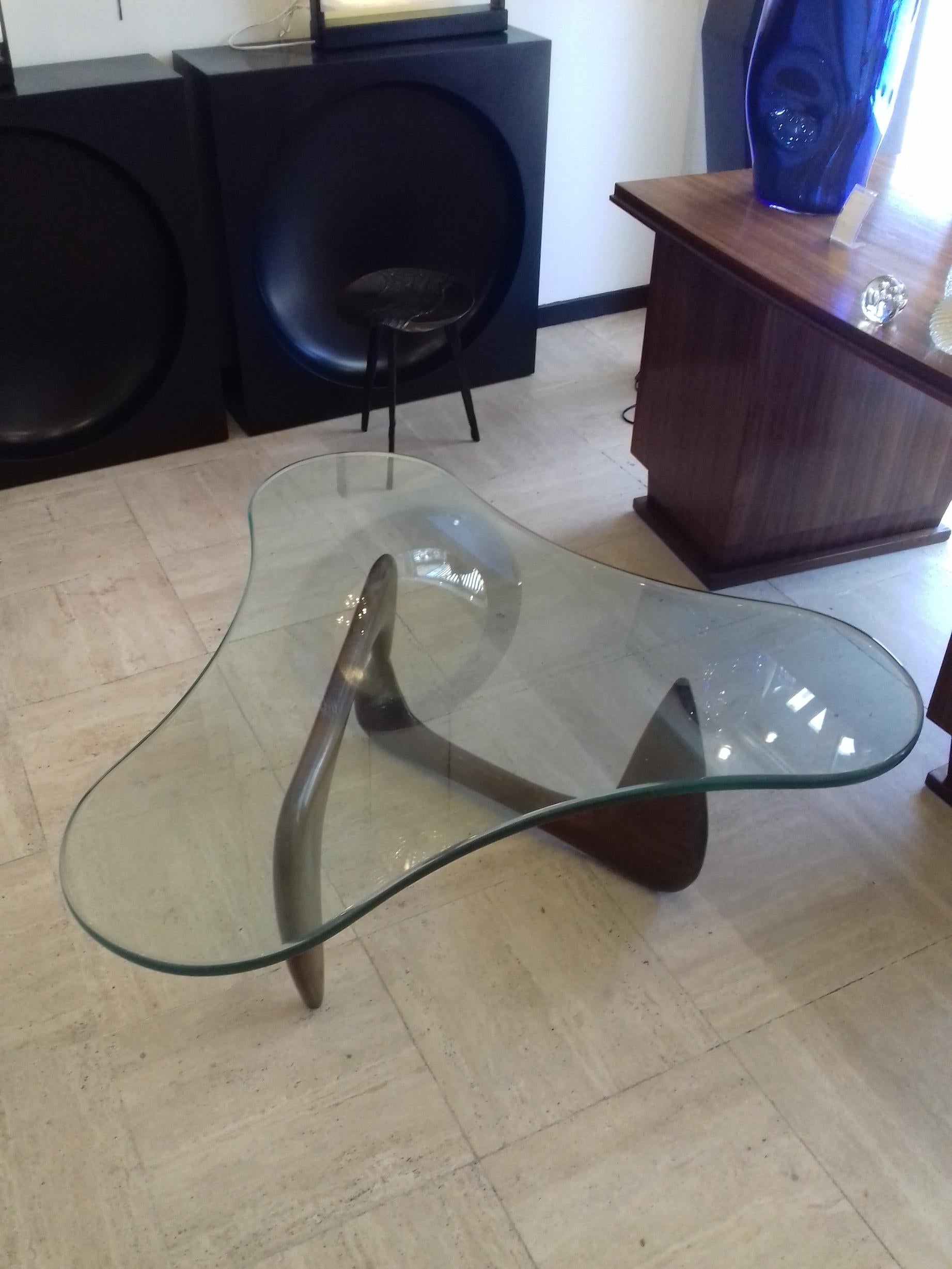 Coffee table, Isamu Noguchi style, free-form thick glass top, solid walnut base.