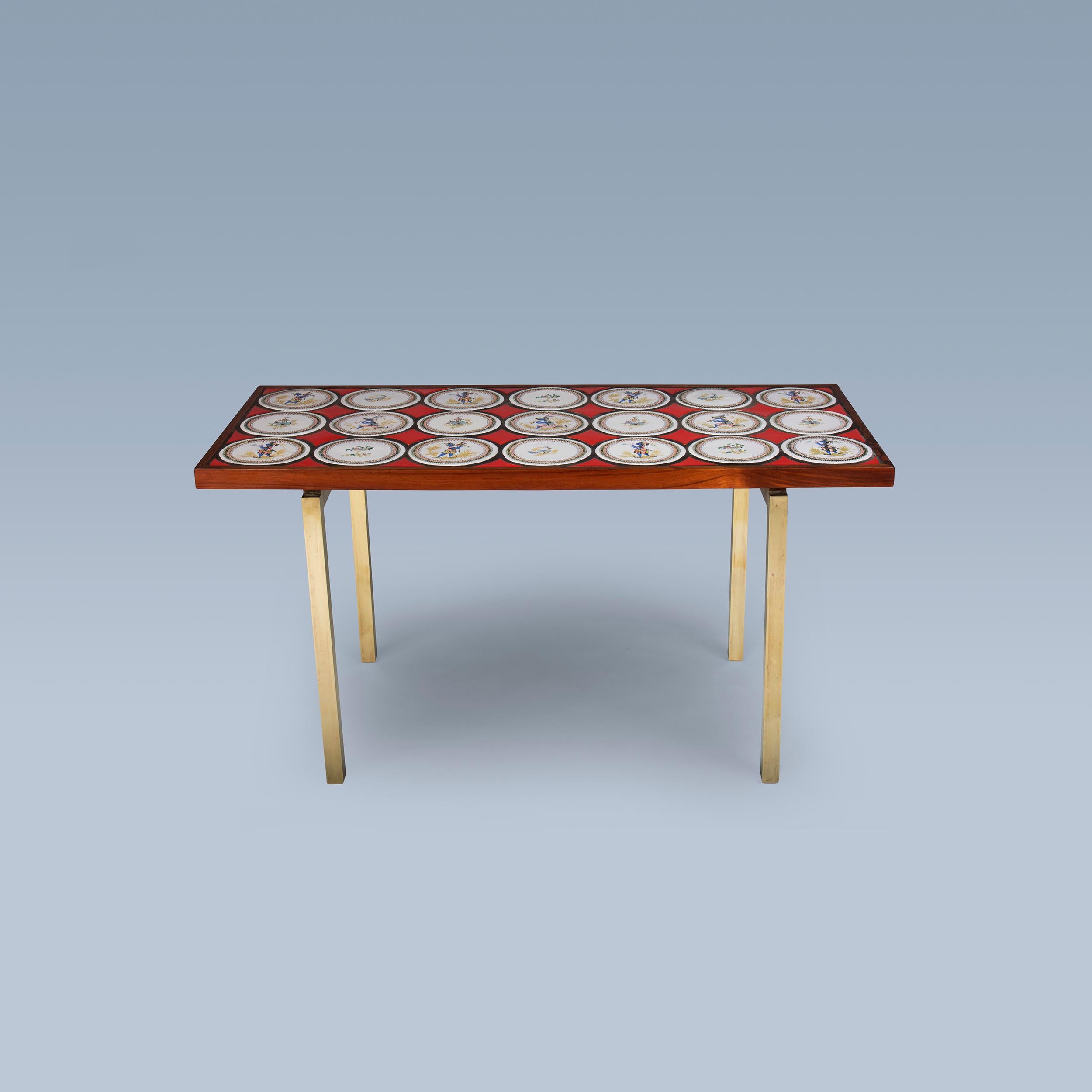This rare coffee table designed by Danish multi-artist Bjørn Wiinblad (1918-2006) has 21 decorative hand-painted tiles on top. Legs are made in bronze.
The table was made in the early 1960s for Danish luxury department store Illum Bolighus in