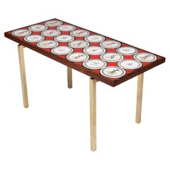 Danish modern coffee table with tiles in red blue, white nuances and bronze legs