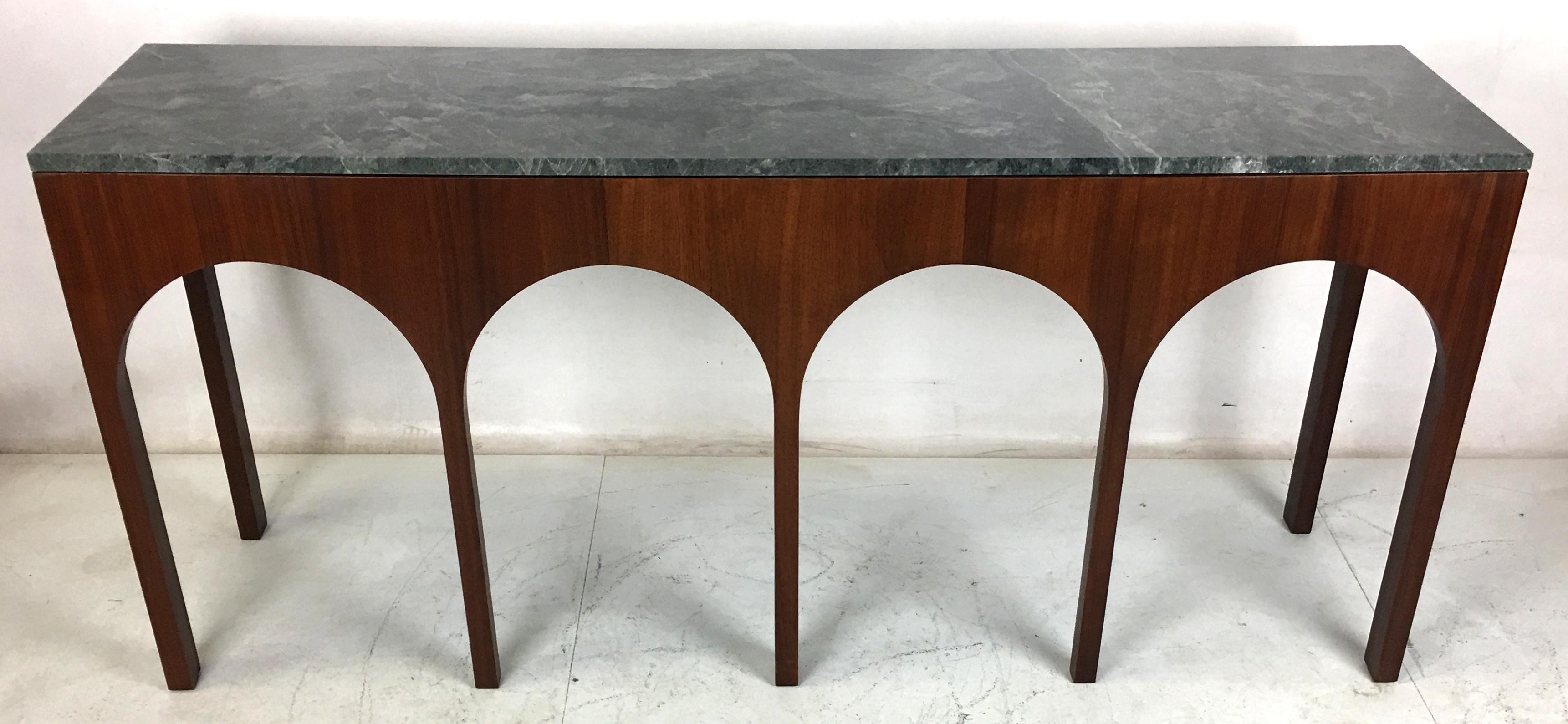 Rare and exquisite walnut console with deep green marble top by T.H. Robsjohn-Gibbings for Widdicomb. The table has been meticulously refinished in open grain Medium-dark Walnut lacquer. The top has been professionally polished and is in perfect