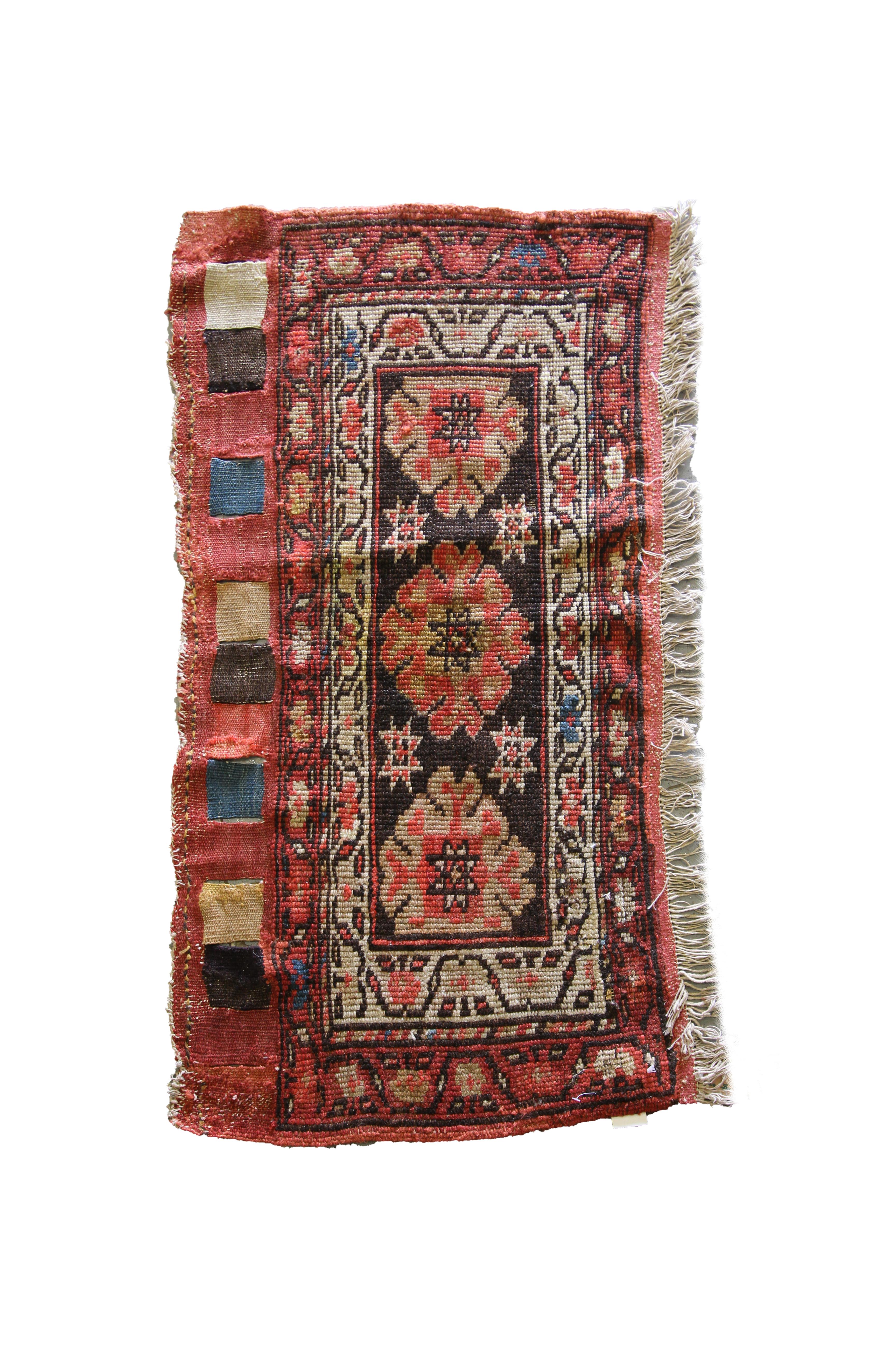 This beautiful unique rug is a rare antique Caucasian rug, woven by hand in the 1880s. The design features a trio of finely woven floral details made up of red and beige accents on a rich brown background. This has then been framed by a layered