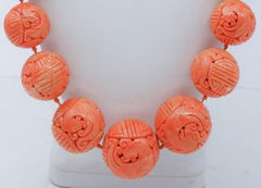 Antique collectible necklace made with large engraved coral spheres