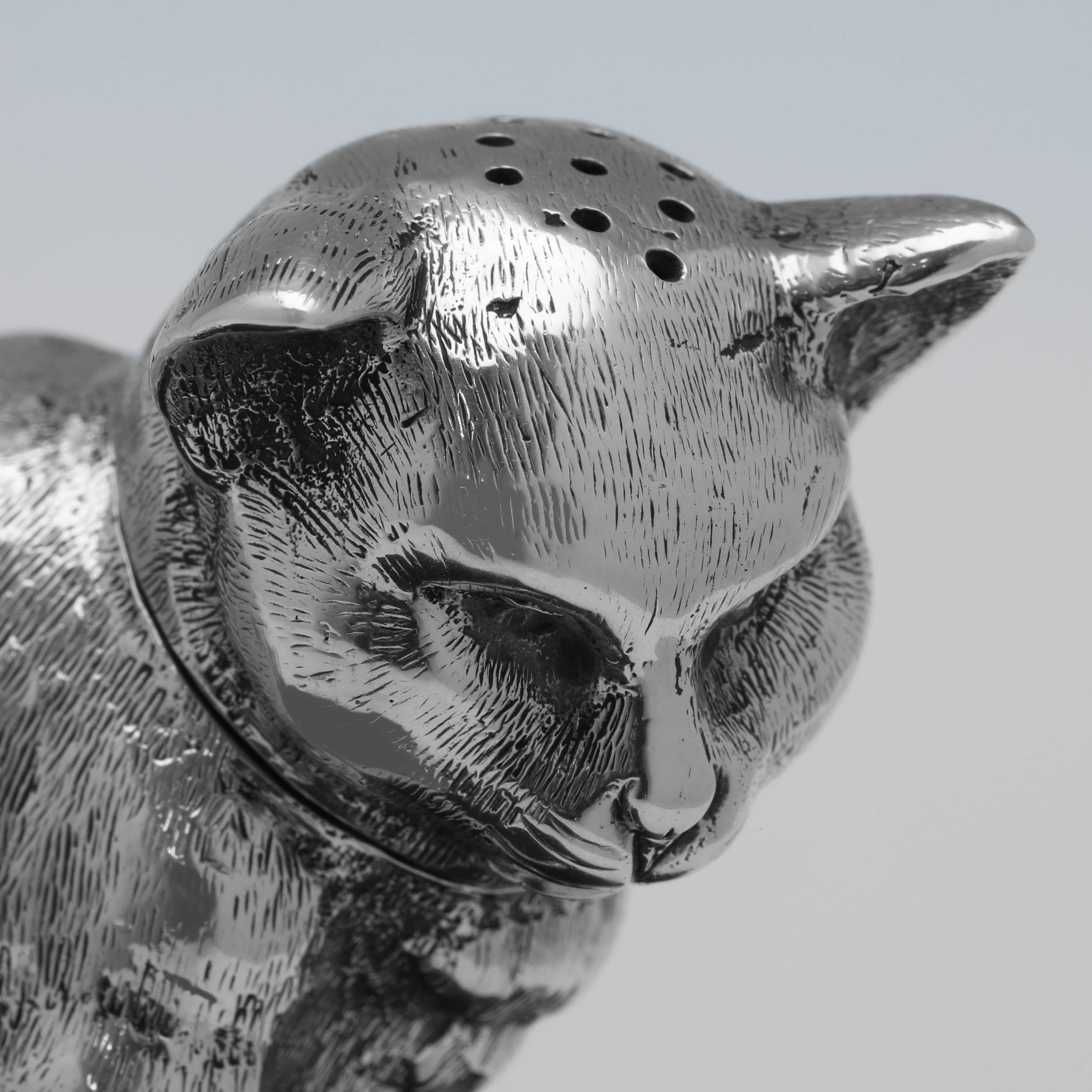 silver cat figurine