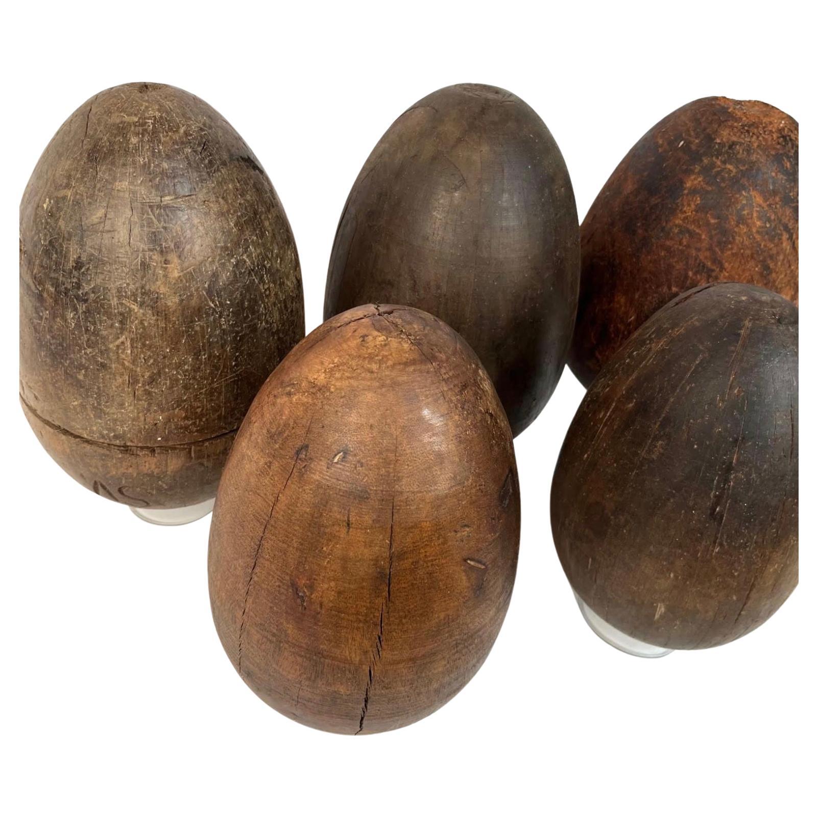 A collection of 5 large 19th century wooden egg-shaped forms used to make paper mache easter eggs. All are hard wood. Measuring 10