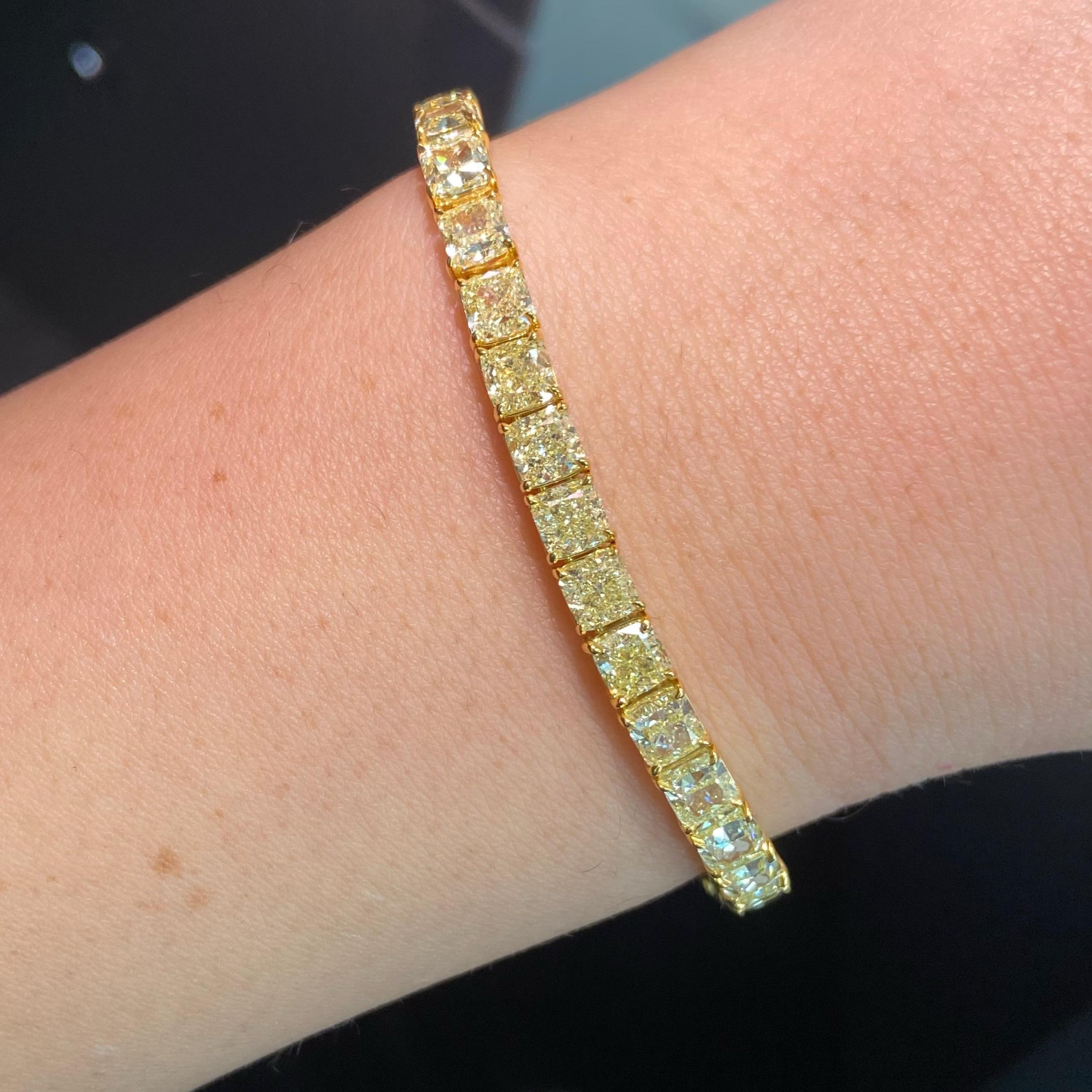 Indulge in the radiant beauty of this exquisite yellow diamond tennis bracelet, a true testament to timeless elegance. Showcasing an impressive 17.49 carats of natural fancy yellow diamonds, this piece combines brilliance with sophistication in
