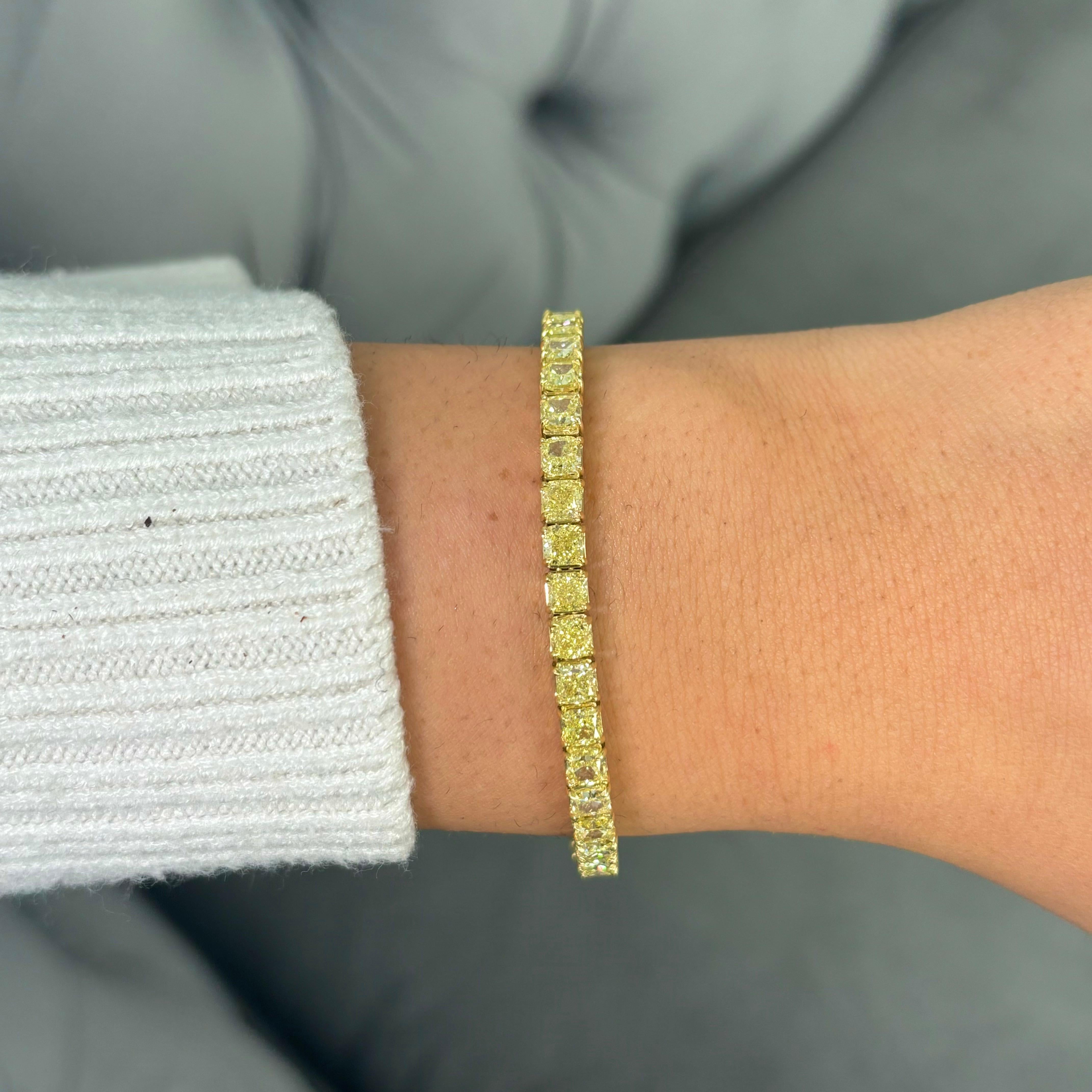 Experience the dazzling allure of this remarkable yellow diamond tennis bracelet, a stunning showcase of color and craftsmanship. Featuring 17.75 carats of fancy intense yellow diamonds, this piece radiates a vibrant glow that captivates at every