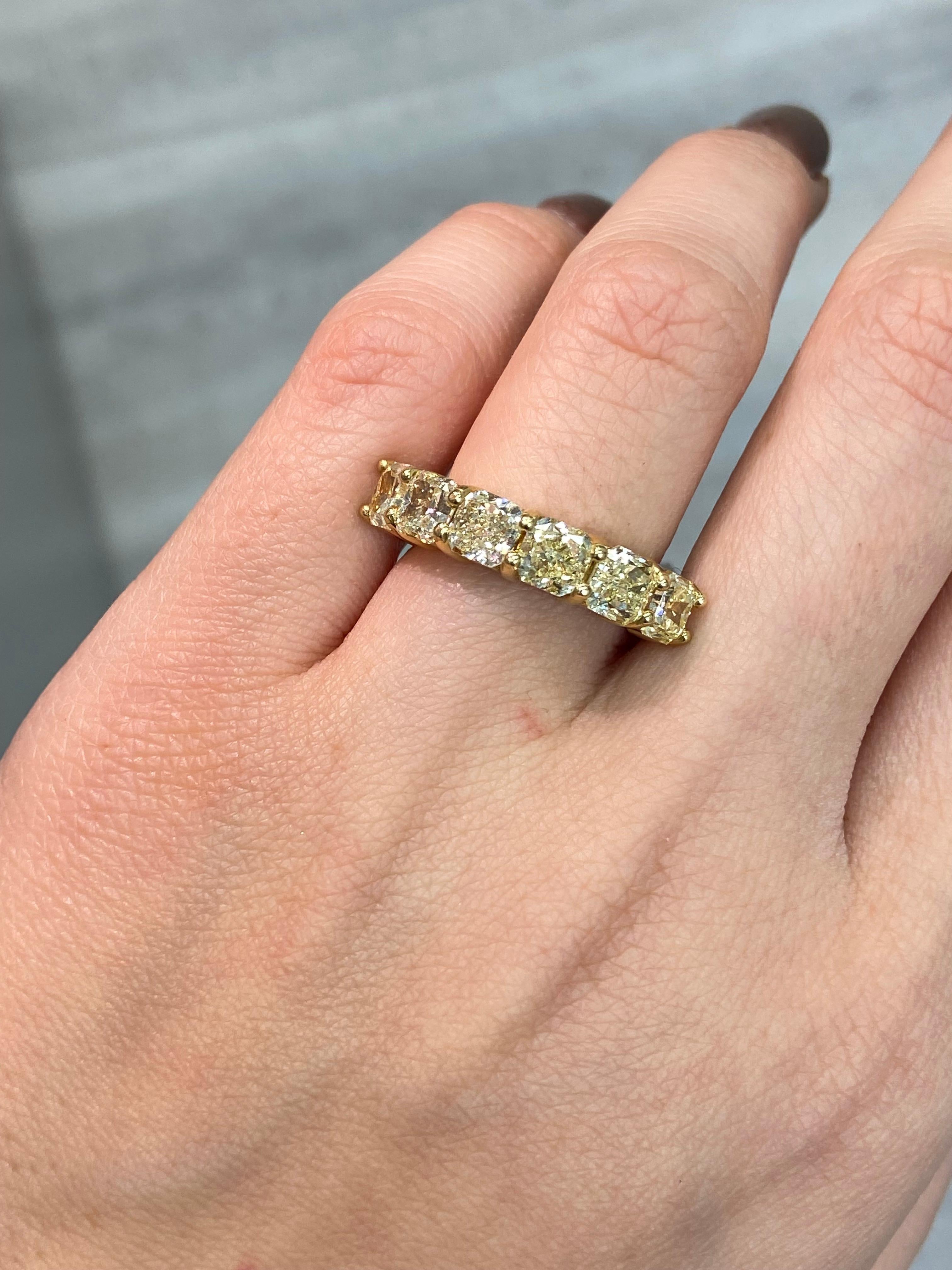 This breathtaking half-eternity band captures the essence of timeless luxury with six radiant-cut fancy yellow diamonds totaling an impressive 4.32 carats. Each stone is expertly hand-selected in VS-VVS clarity, ensuring unparalleled sparkle and
