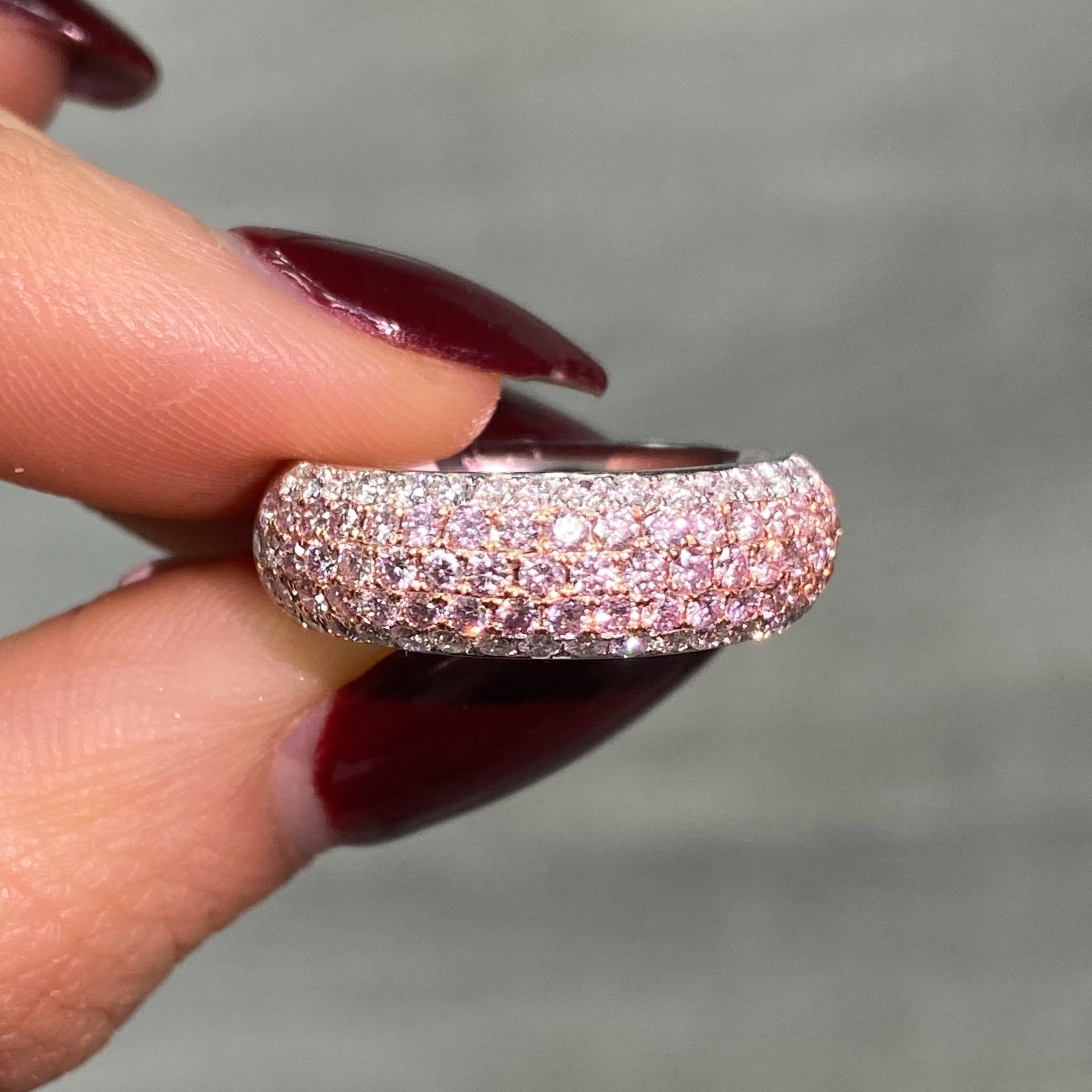 Indulge in timeless beauty with this five-row half-eternity ring, featuring 1.23 total carats of expertly selected diamonds. The design highlights 0.78 carats of fancy pink diamonds paired with 0.45 carats of brilliant white round diamonds, creating