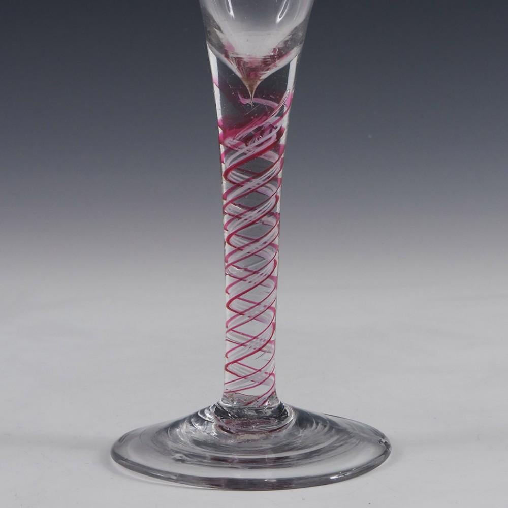 Rare Colour Twist Wine Glass, c1780

Additional Information:
Heading : A Very Rare Colour Twist Wine Glass
Origin : Almost certainly Saxony
Colour : Good grey tone in the glass with ruby red and white within the stem
Bowl : Drawn trumpet
Stem : A