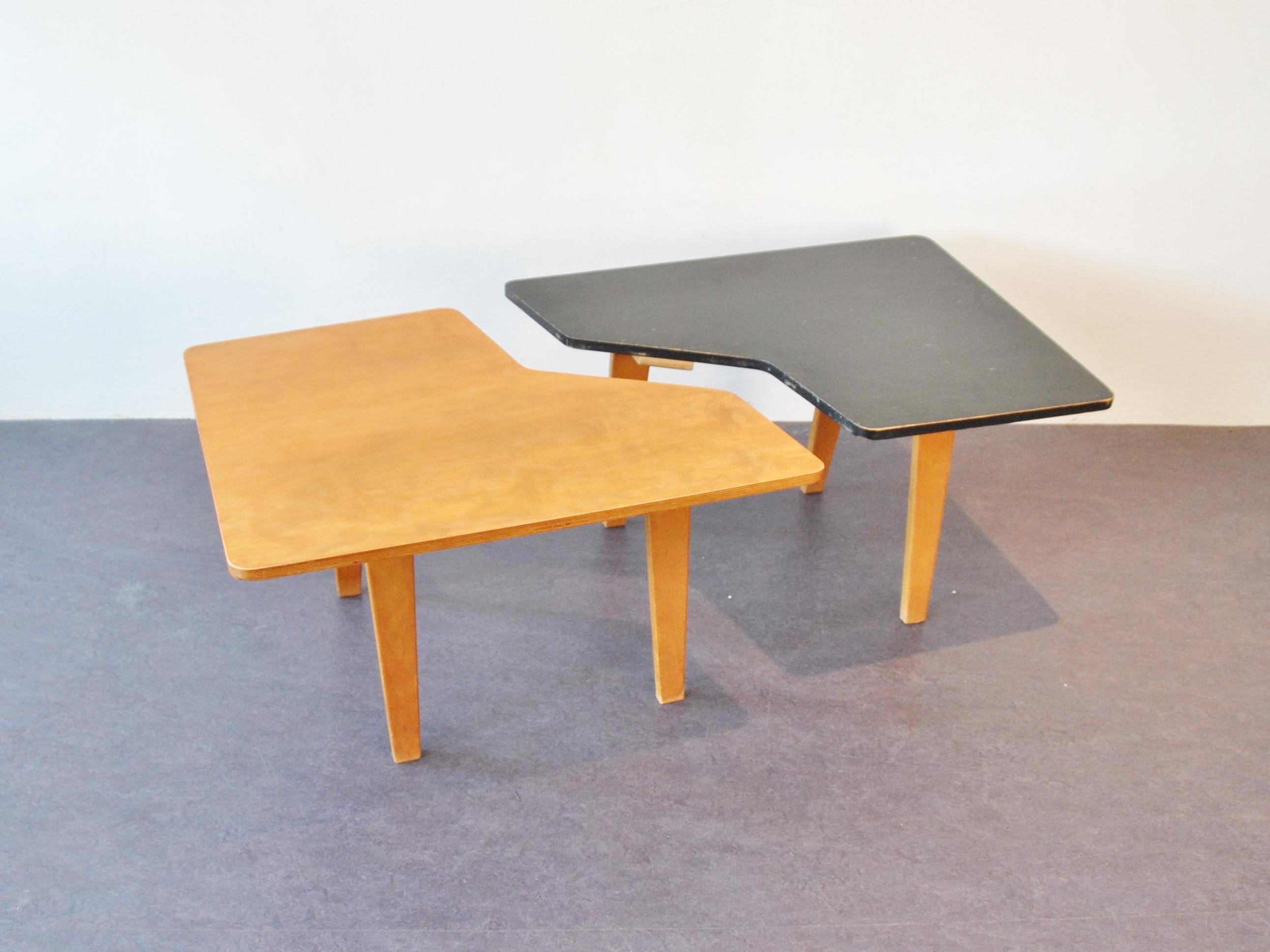 These tables are rare to come by. The set of two makes a perfect match due to the puzzle shape. The tables can be attached or used separately. The combex series is one of the earliest works by Cees Braakman. The black table is fully original, the
