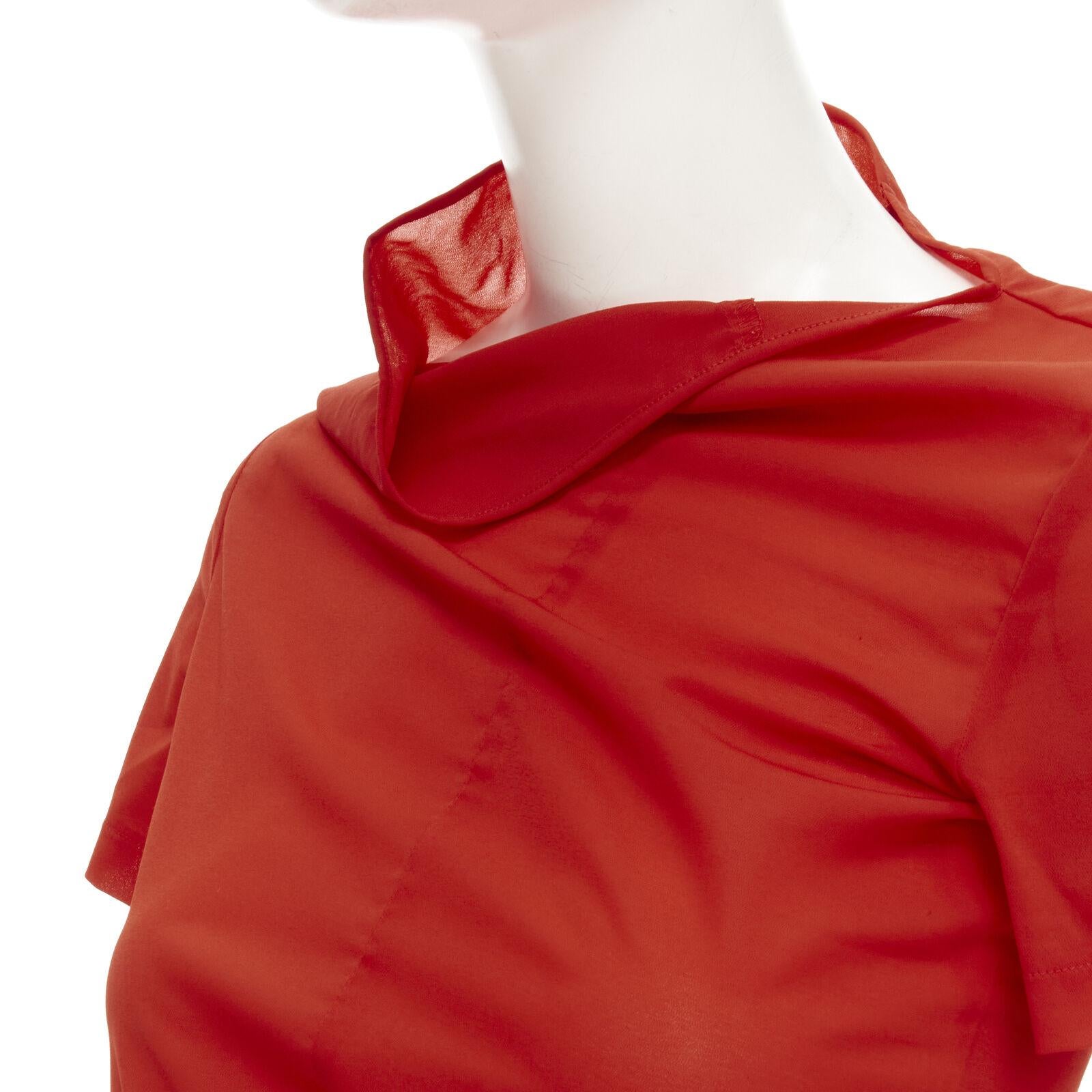 rare COMME DES GARCONS 1997 Lumps Bumps red asymmetric cowl neck bias cut top
Reference: CRTI/A00736
Brand: Comme Des Garcons
Designer: Rei Kawakubo
Model: Red short sleeve irregular top
Collection: Spring Summer 1997
Material: Polyester,