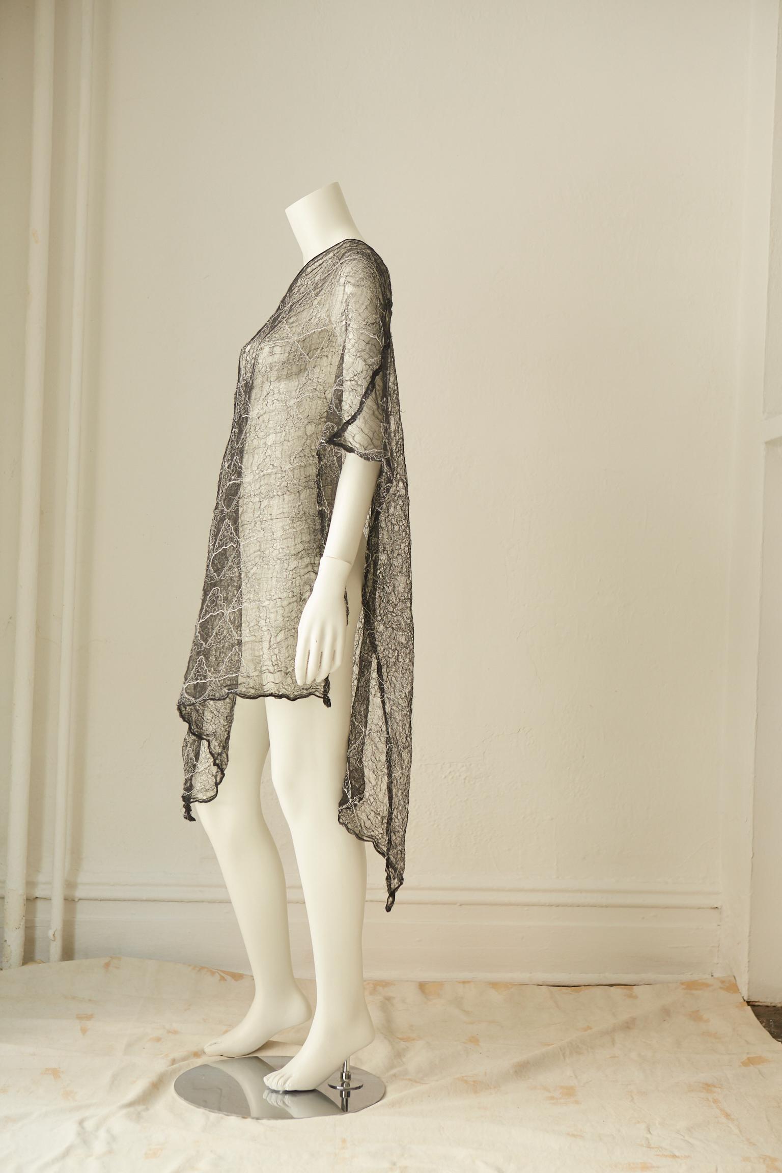 
Rare diaphanous lace cotton tunic dress designed in 1987 by Rei Kawakubo (Japanese, born 1942) for her avant garde Comme des Garcons design house. 
One of the same dresses is also part of the permanent Costume Institute Collection at the