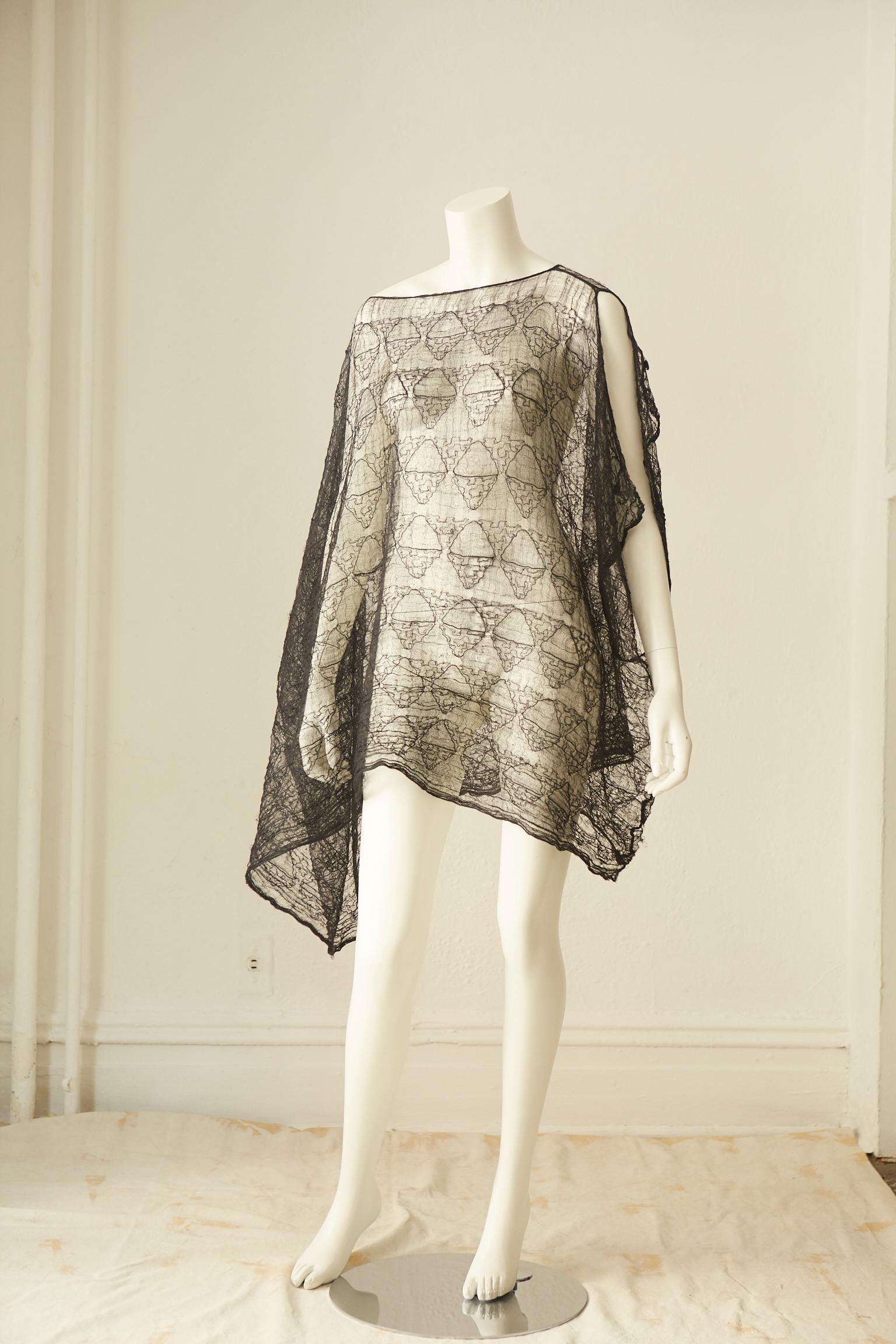 Rare diaphanous black cotton lace tunic dress designed in 1987 by Rei Kawakubo (Japanese, born 1942) for her avant garde Comme des Garcons design house.
The dress has multiple ways of wearing, creating wonderful dimensions and looks.
One of the same