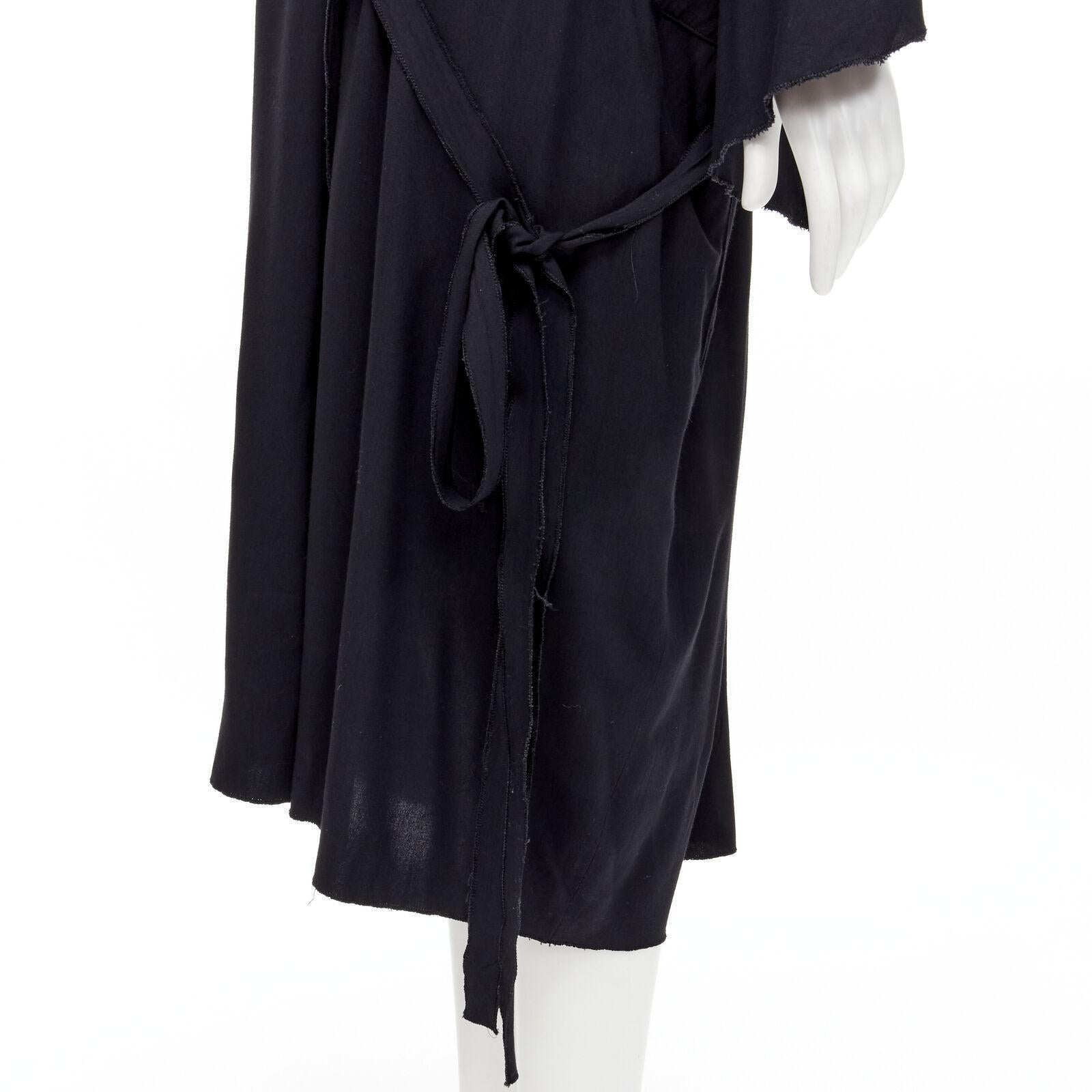 rare COMME DES GARCONS Vintage 1980's black asymmetric wrap kimono robe dress
Reference: CRTI/A00698
Brand: Comme Des Garcons
Designer: Rei Kawakubo
Collection: 1980s
Material: Rayon
Color: Black
Pattern: Solid
Closure: Wrap Tie
Extra Details: Dual