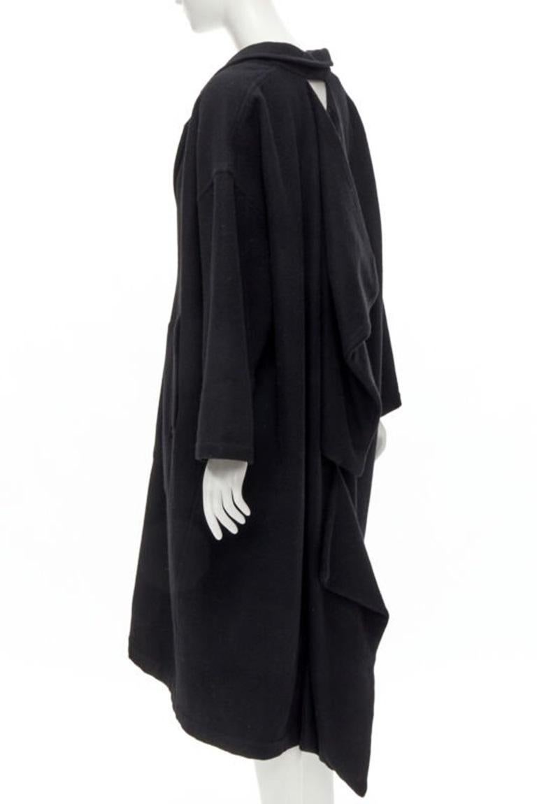 rare COMME DES GARCONS Vintage 1980's Dinosaur jagged cut out draped  coat M
Reference: CRTI/A00697
Brand: Comme Des Garcons
Designer: Rei Kawakubo
Collection: 1980s - Runway
Material: Feels like wool
Color: Black
Pattern: Solid
Closure: