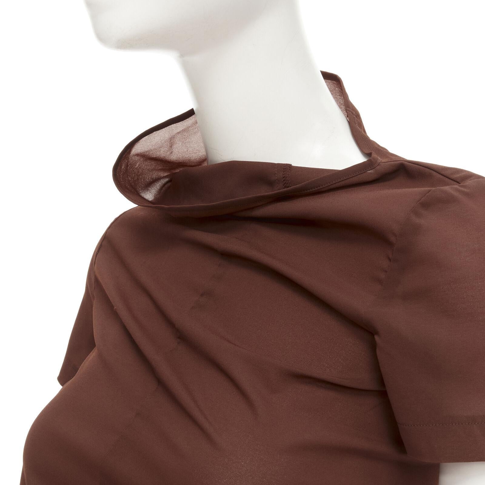 rare COMME DES GARCONS Vintage 1997 brown bias cowl neck irregular top
Reference: CRTI/A00735
Brand: Comme Des Garcons
Designer: Rei Kawakubo
Collection: 1997
Material: Polyester, Blend
Color: Brown
Pattern: Solid
Closure: Pull On
Made in: