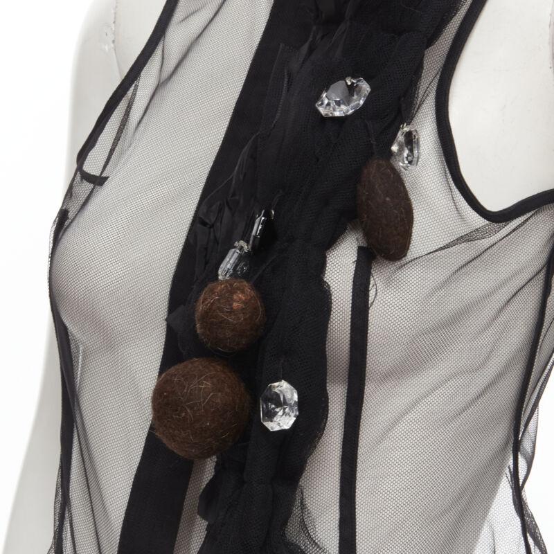rare COMME DES GARCONS Vintage 2004 Runway crystals felt balls sheer vest S
Reference: CRTI/A00688
Brand: Comme Des Garcons
Designer: Rei Kawakubo
Collection: Runway
Material: Feels like polyester
Color: Black, Multicolour
Pattern: Solid
Closure: