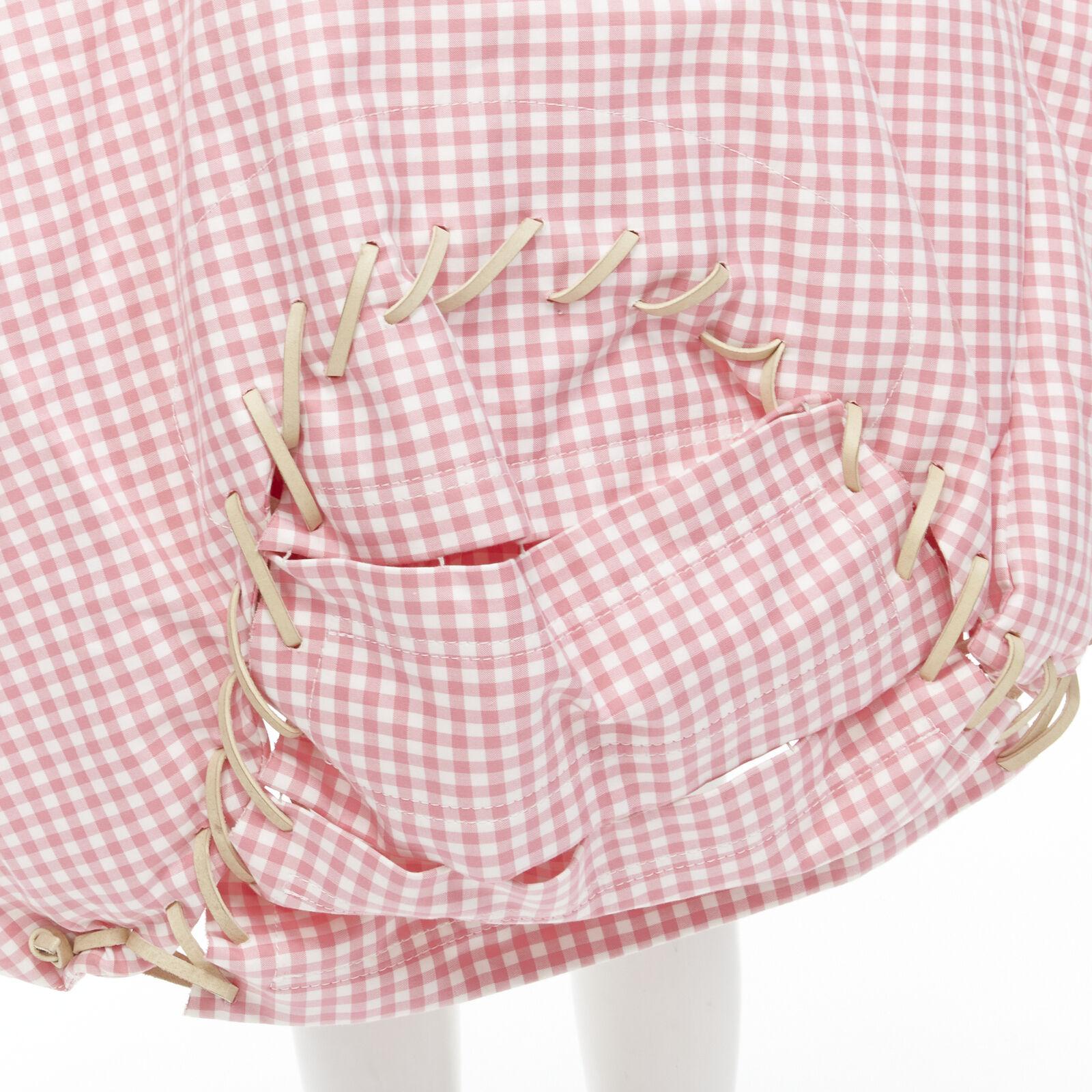 rare COMME DES GARCONS Vintage 2004 Runway pink checked  Punk balloon skirt
Reference: CRTI/A00709
Brand: Comme Des Garcons
Designer: Rei Kawakubo
Collection: 2004 - Runway
Material: Cotton
Color: Pink, White
Pattern: Checkered
Closure: Lace